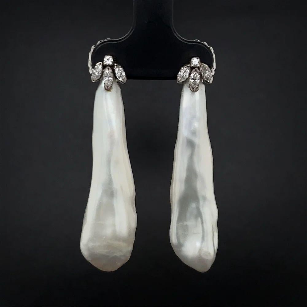 Simply Beautiful! Each earring features a Large Natural Baroque Pearl, accented by Diamonds, weighing approx. 0.42tcw. Length of each earring: 1.75