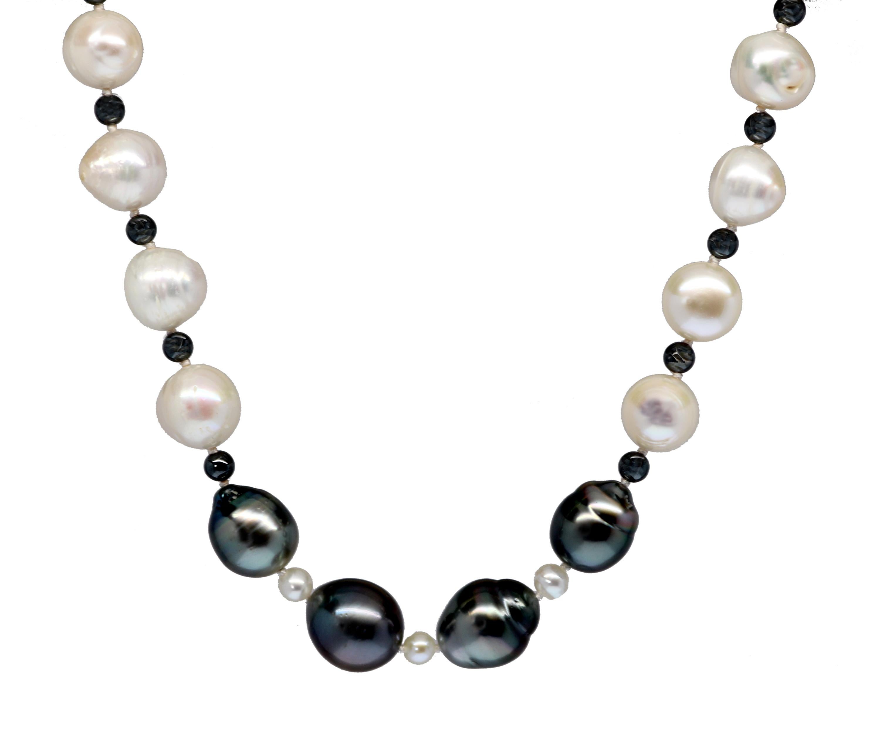 Classic with a modern twist, this newly designed piece features four beautifully natural soft gray baroque pearls and twenty four  10-1/4 mm white baroque ringed Akoya pearls all hand strung and accented with 4 mm hematite beads. The pearls selected