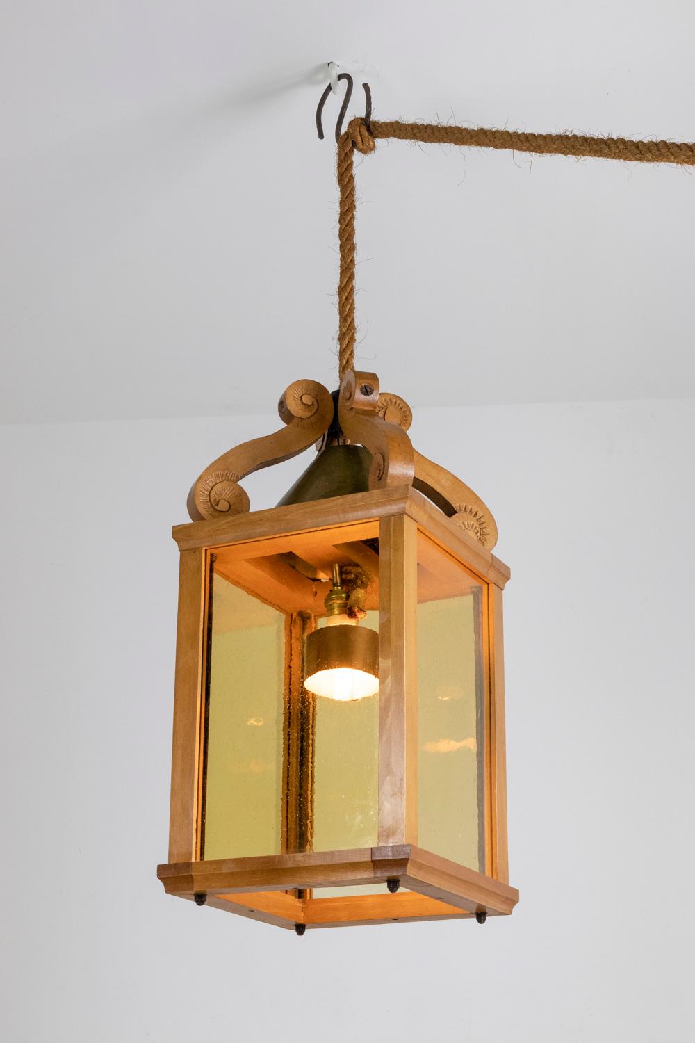 Lantern in natural beech and rope, rectangular in shape and adorned with waves in the upper part. Bubbled and colored glass.

French work realized in the 1950.

Dimensions : H 70 x W 34 x D 34 cm

New and fonctionnal electrical system.

Reference :