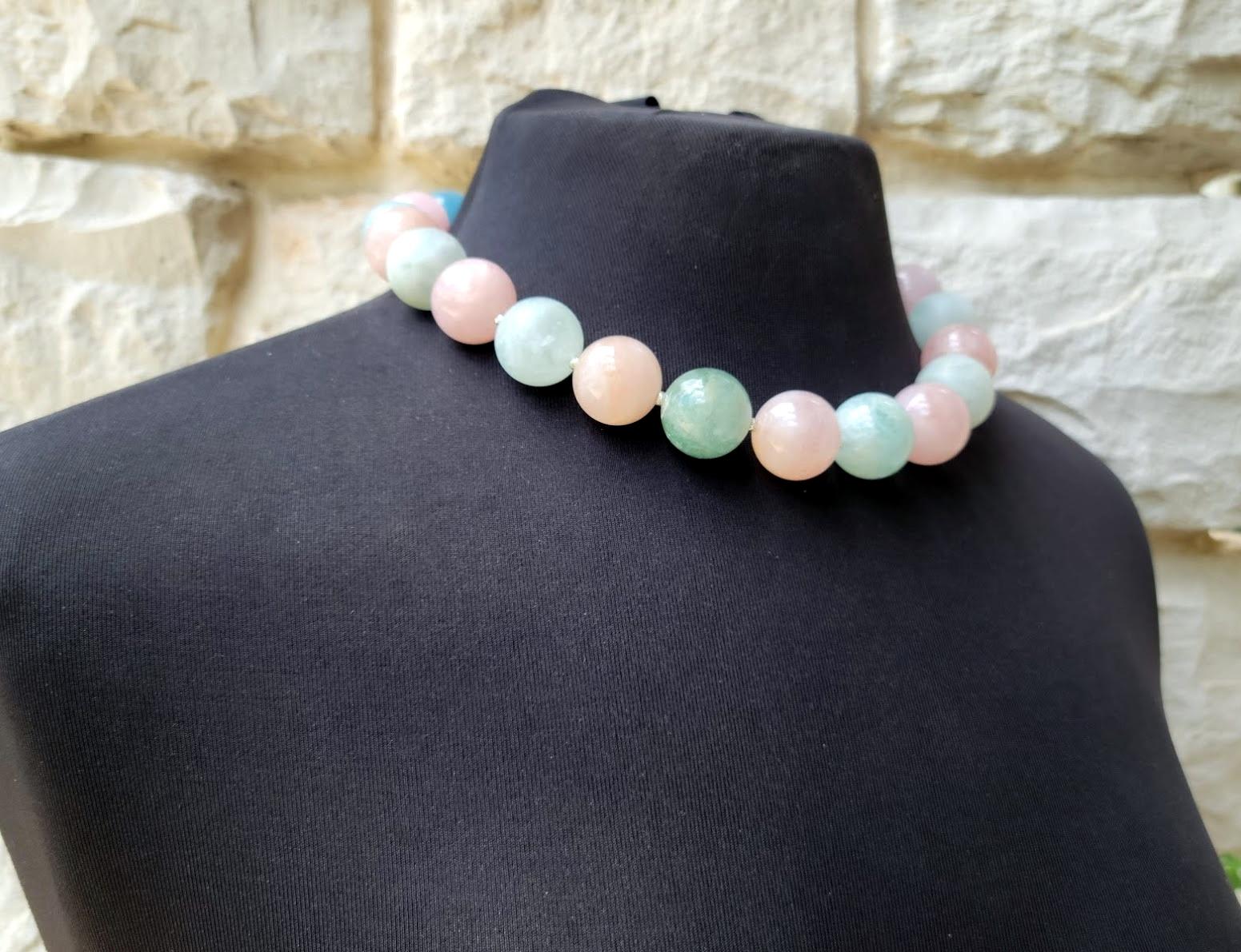 The length of the necklace is 19 inches (48 cm). The size of the smooth round beads is 20 mm.
The color of the beads is a soft shade of light green, light blue, pale peachy pink, and pale orange. Very gentle soft pastel colors! Huge statement beads