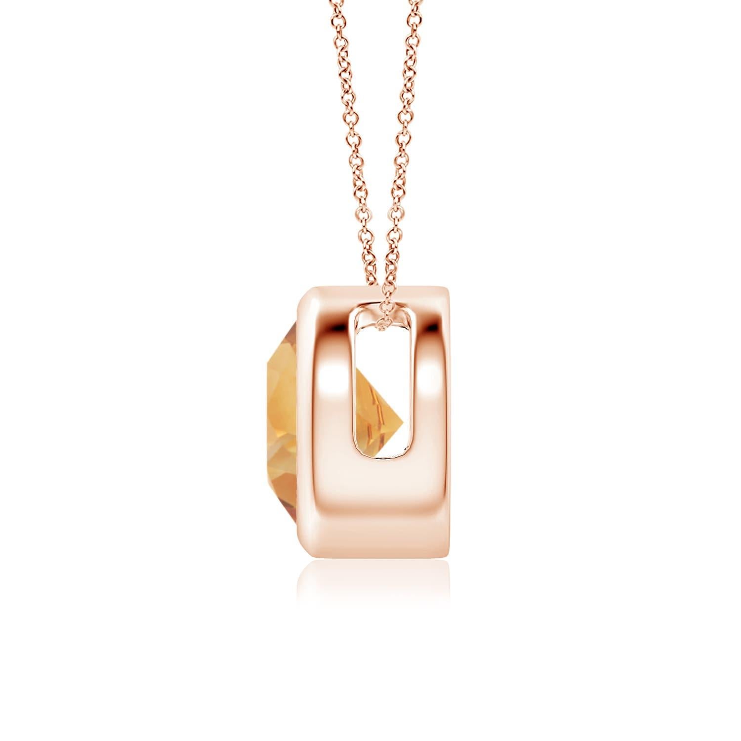La citrine ronde de couleur jaune miel semble flotter sur la chaîne. Il est fixé dans une monture en or rose 14k. Ce pendentif en citrine, à la fois simple et séduisant, est conçu pour faire une déclaration élégante. Disponible en différents poids