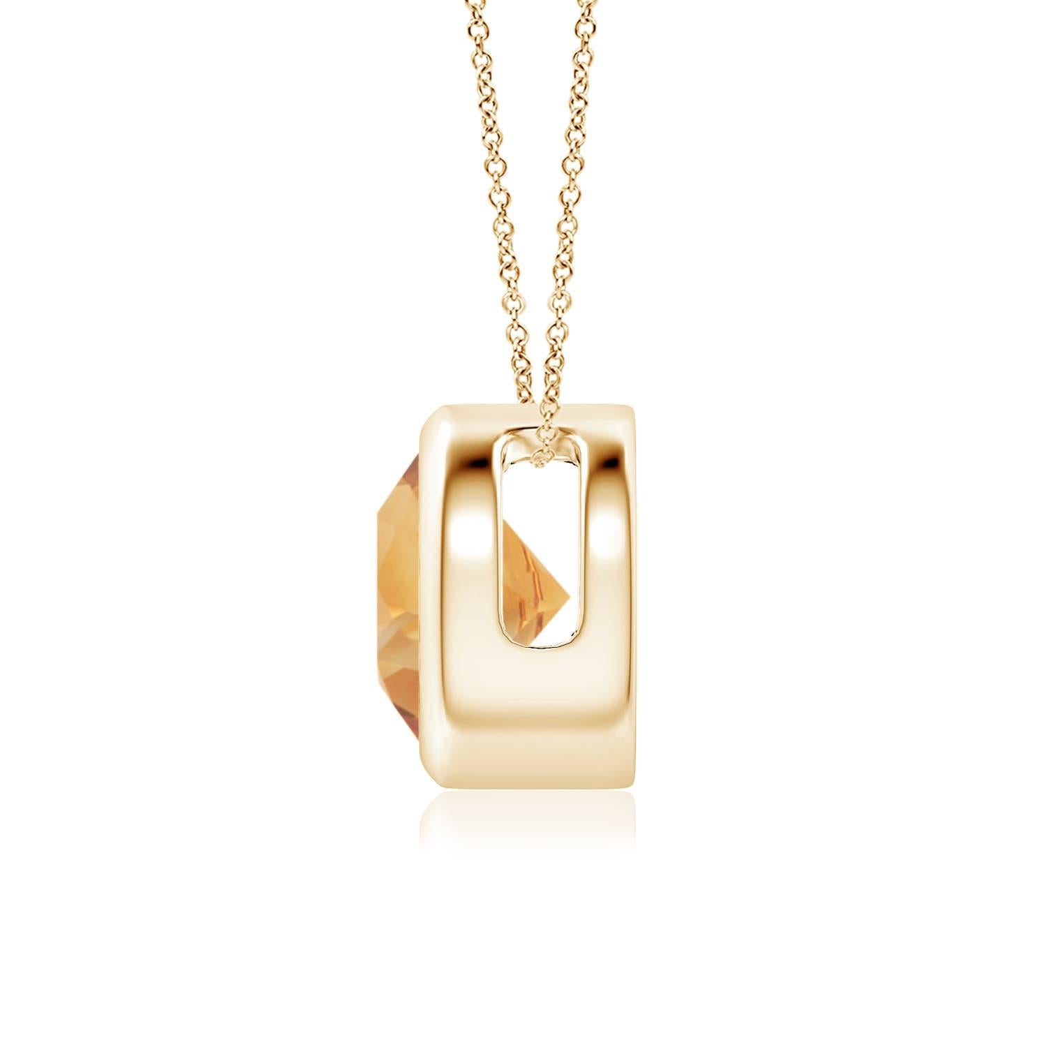 La citrine ronde de couleur jaune miel semble flotter sur la chaîne. Il est fixé dans une monture en or jaune 14k. Ce pendentif en citrine, à la fois simple et séduisant, est conçu pour faire une déclaration élégante. Disponible en différents poids