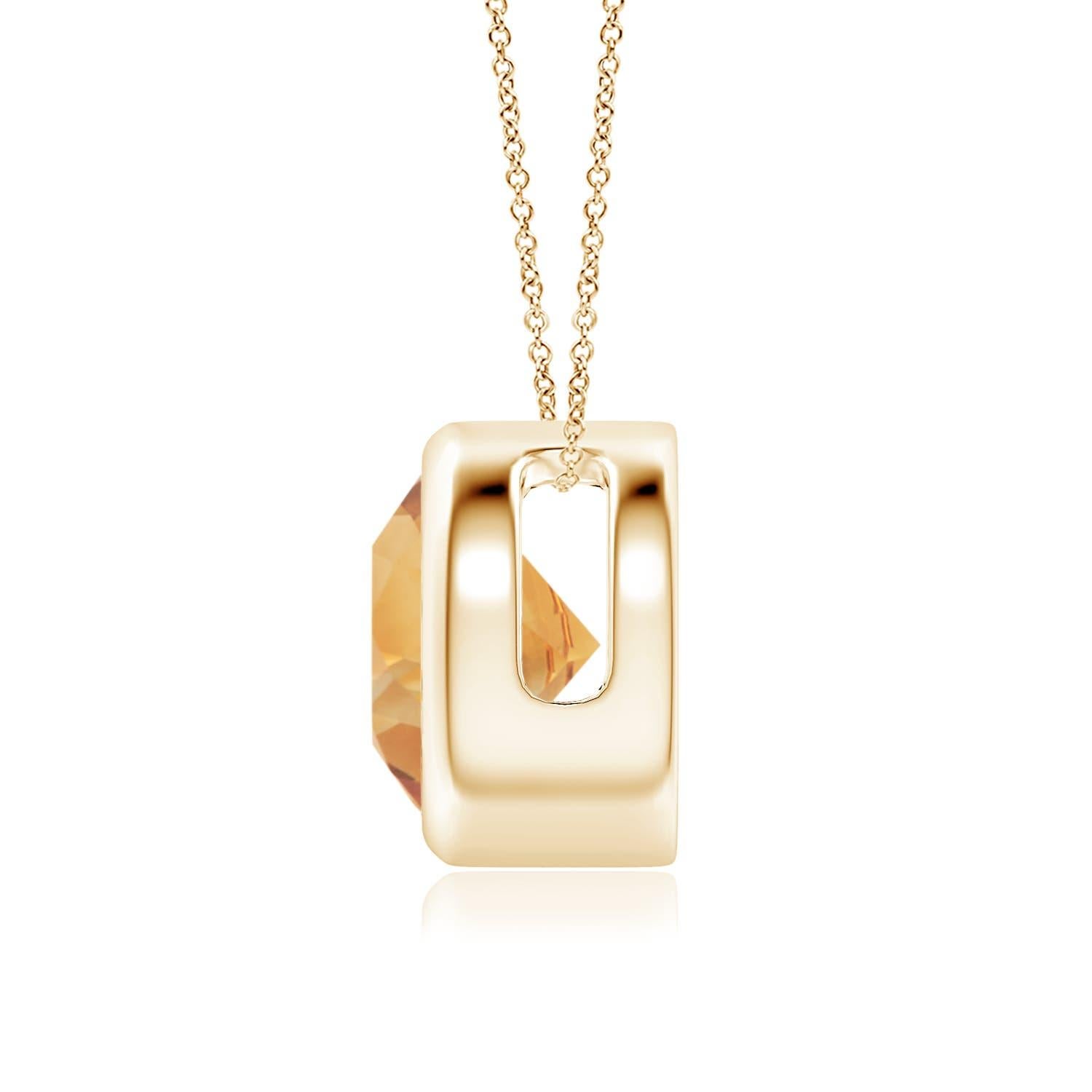La citrine ronde de couleur jaune miel semble flotter sur la chaîne. Il est fixé dans une monture en or jaune 14k. Ce pendentif en citrine, à la fois simple et séduisant, est conçu pour faire une déclaration élégante. Disponible en différents poids
