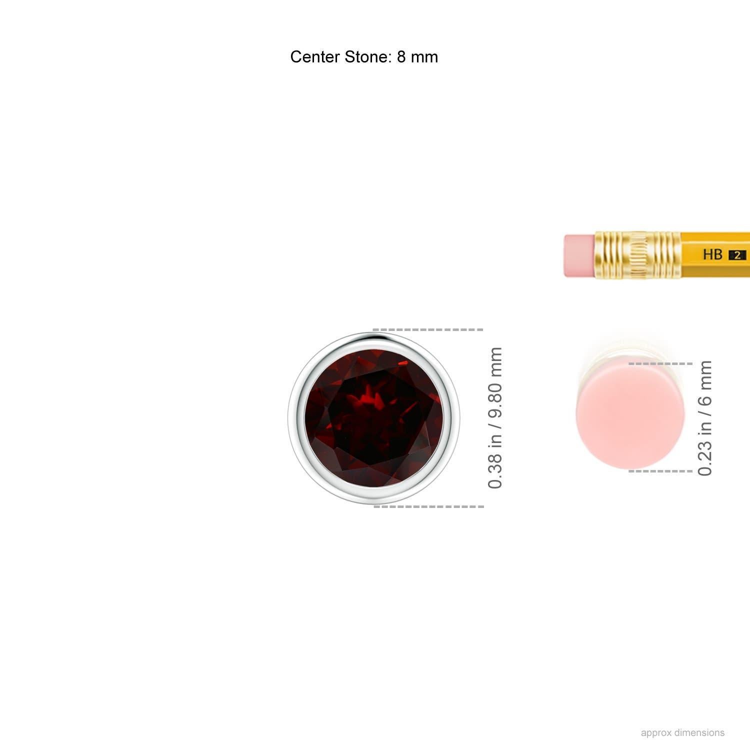 Le grenat rond rouge intense semble flotter sur la chaîne. Il est fixé dans une lunette en platine. Ce pendentif en grenat, à la fois simple et séduisant, est conçu pour faire une déclaration élégante.