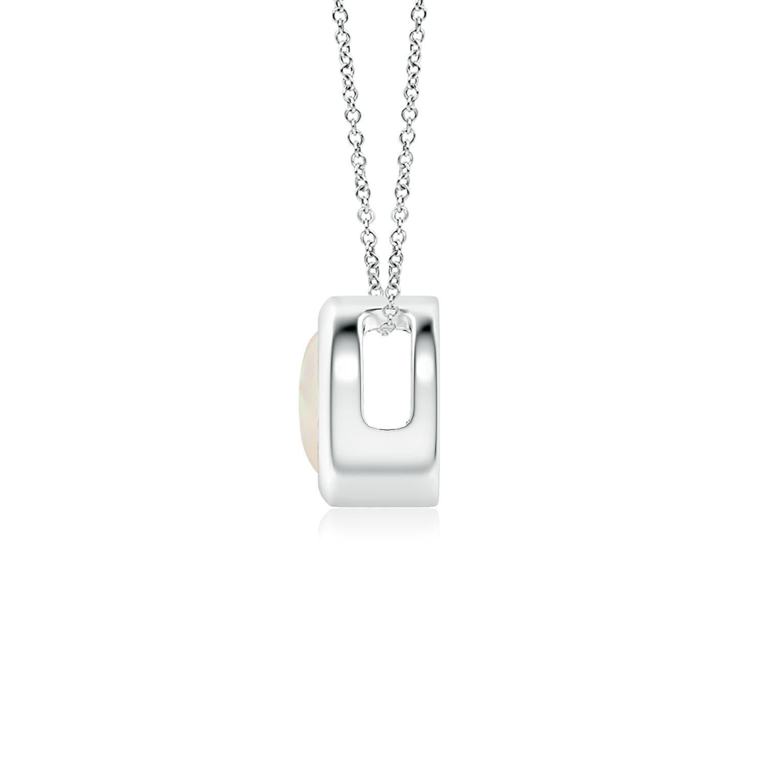 The mesmerizing round opal appears to be floating on the chain. It is secured in a platinum bezel setting. This simple yet alluring opal pendant is designed to make an elegant style statement with its stunning play of colors. Available in different