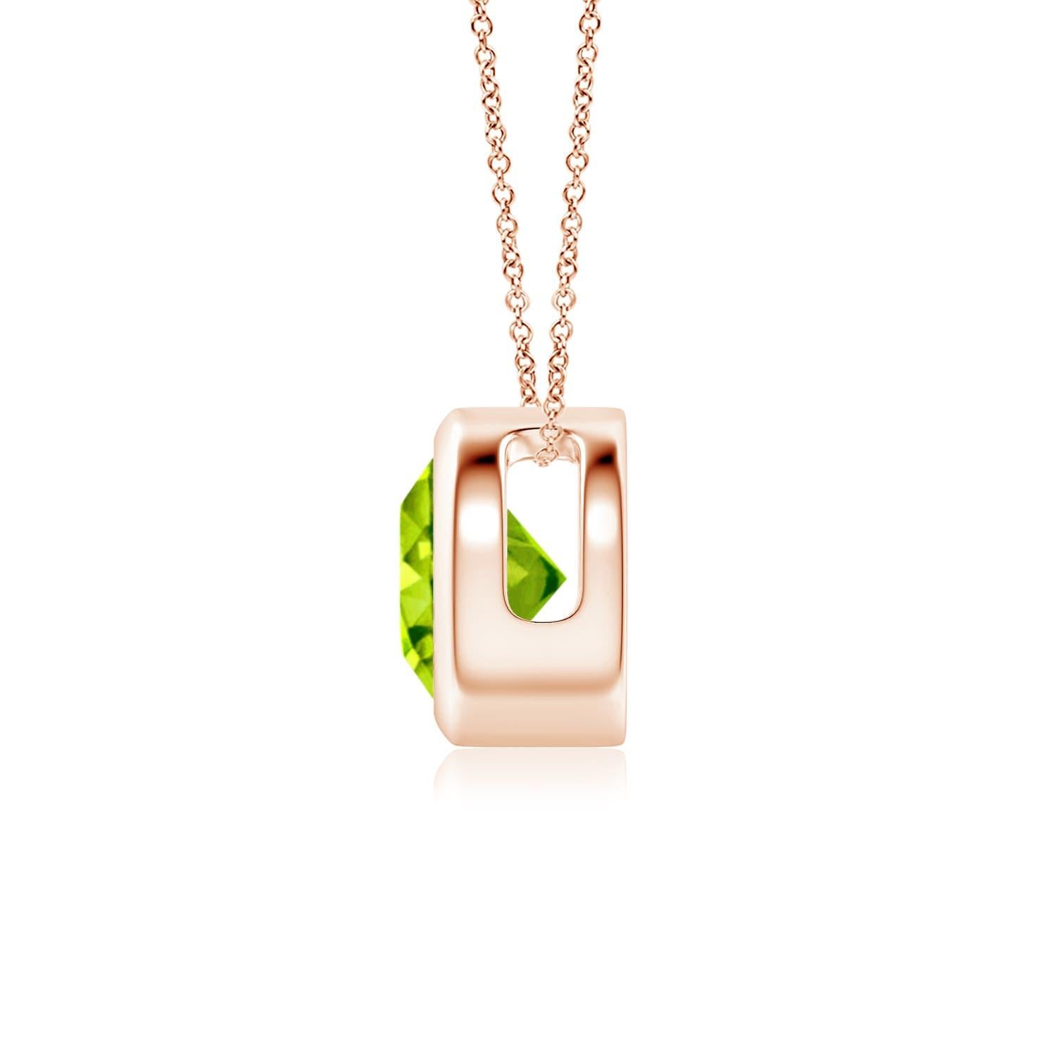The olive green round peridot appears to be floating on the chain. It is secured in a 14k rose gold bezel setting. This simple yet alluring peridot pendant is designed to make an elegant statement. Available in different carat weight. 

Peridot is