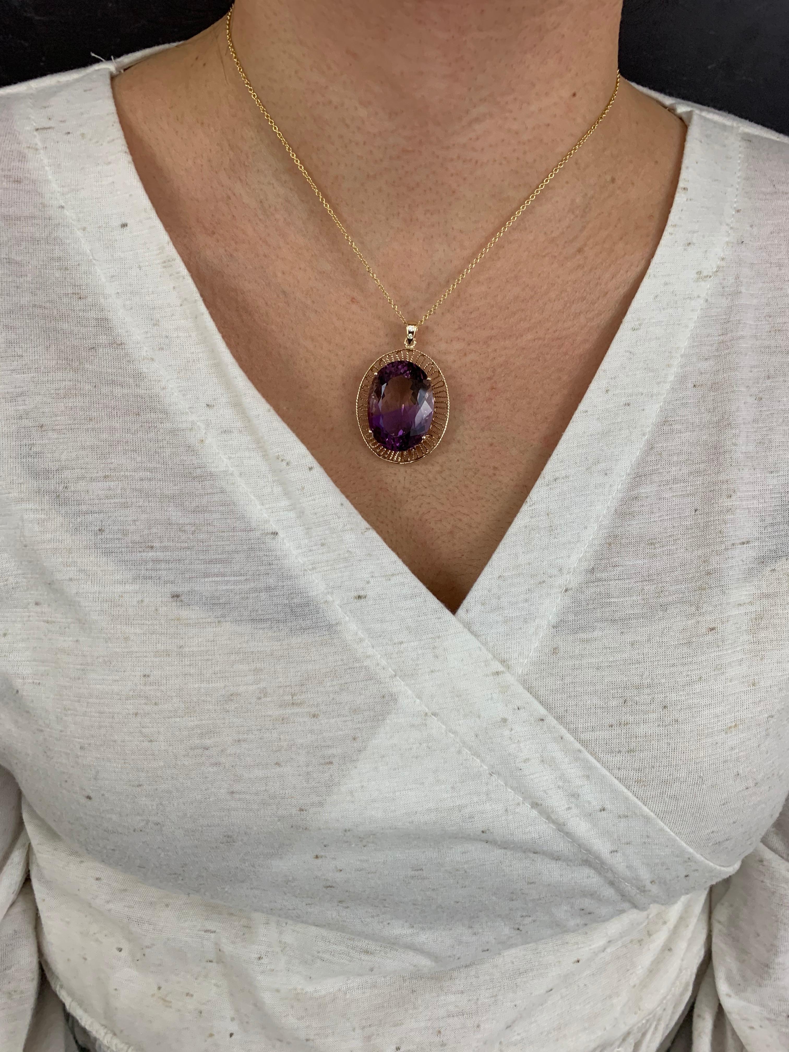 Metal: 14K Two-Tone - Rose Gold and Yellow Gold

1 Oval Shaped Naturally Bicolor Ametrine at 46.96 carats
Ametrine is a natural stone that is comprised of Amethyst and Citrine

0.05 Carats of Round Brilliant White Diamonds
Clarity: SI / Color: