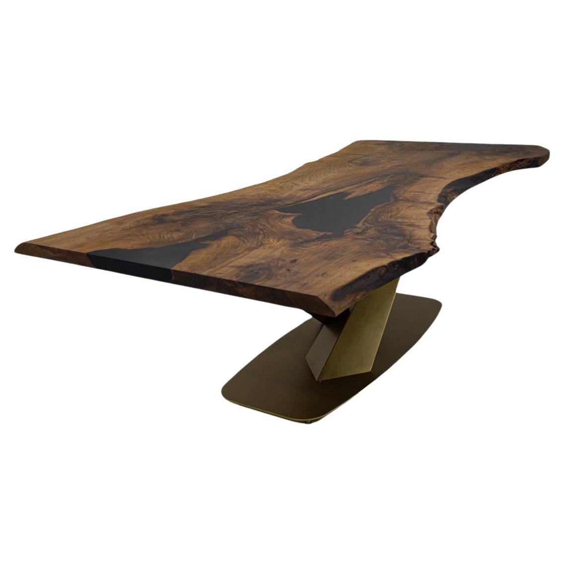 One Piece (Single Slab) Walnut Table

Some Walnut slabs have a lot of natural beauty as it’s one side has a large curve. This is one of them! 

We've filled the cracks with black epoxy., without disrupting naturalness of the slab!

If you'd like to