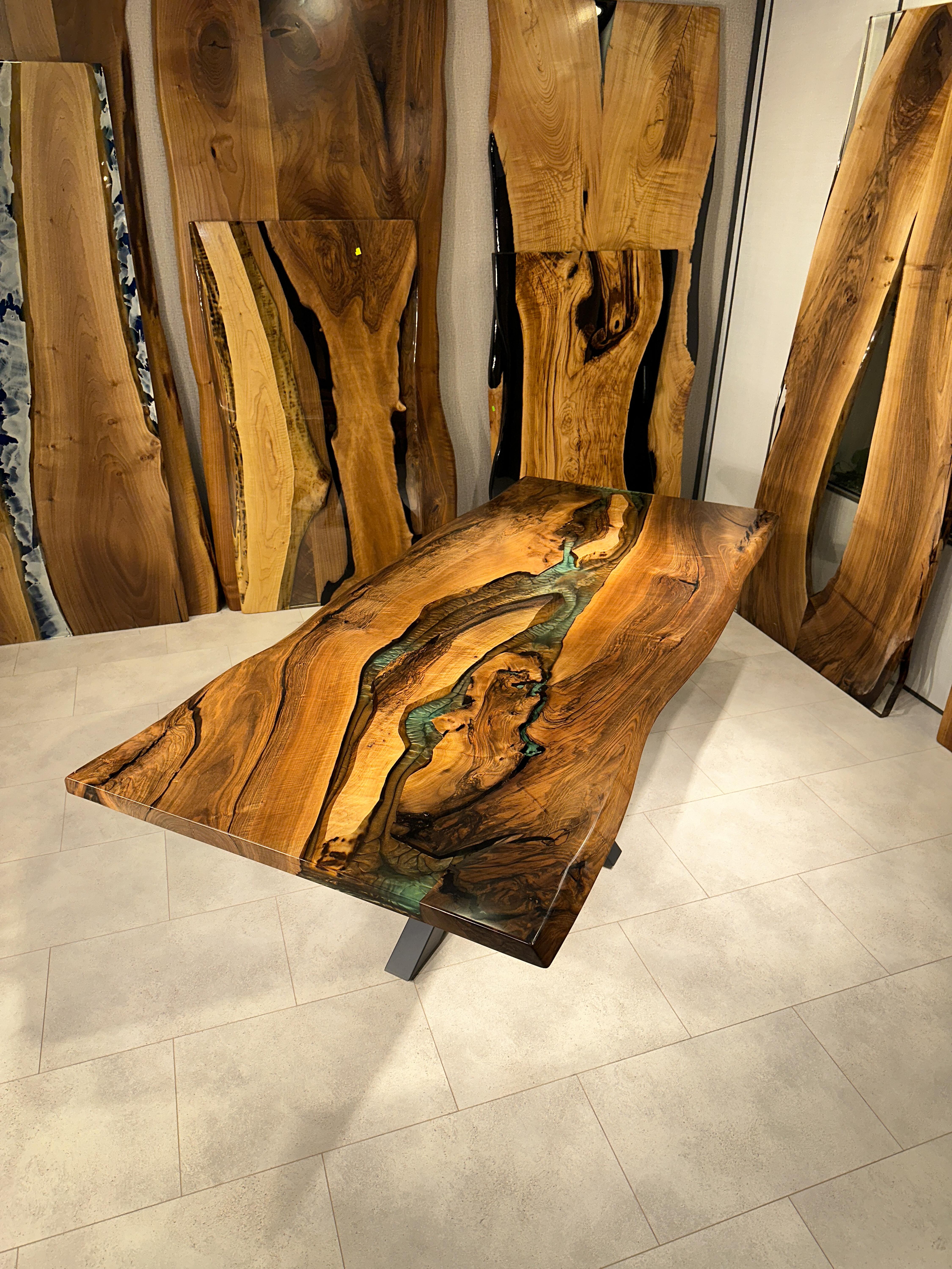 WALNUT EPOXY RESIN DINING TABLE

This epoxy table emerges as a unique work of art, inspired by nature's beauty. 

The epoxy table stands out not only for its design but also its durability. Thanks to its epoxy coating, it is highly resistant to