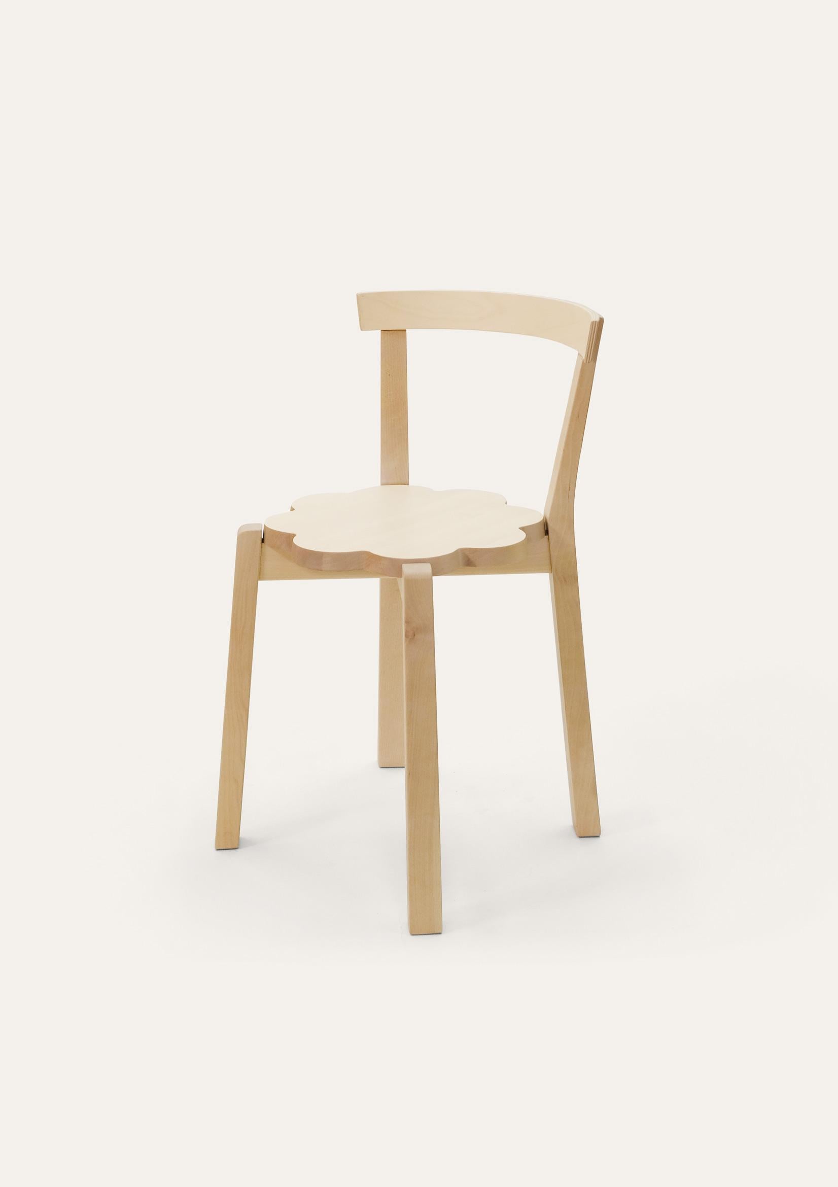 Natural Blossom chair by Storängen Design
Dimensions: D 46 x W 41 x H 72 x SH 45cm
Materials: birch wood.
Available in other colors and sizes.

A small and neat stackable chair, which works well round tables in cafes and living rooms.
A clean