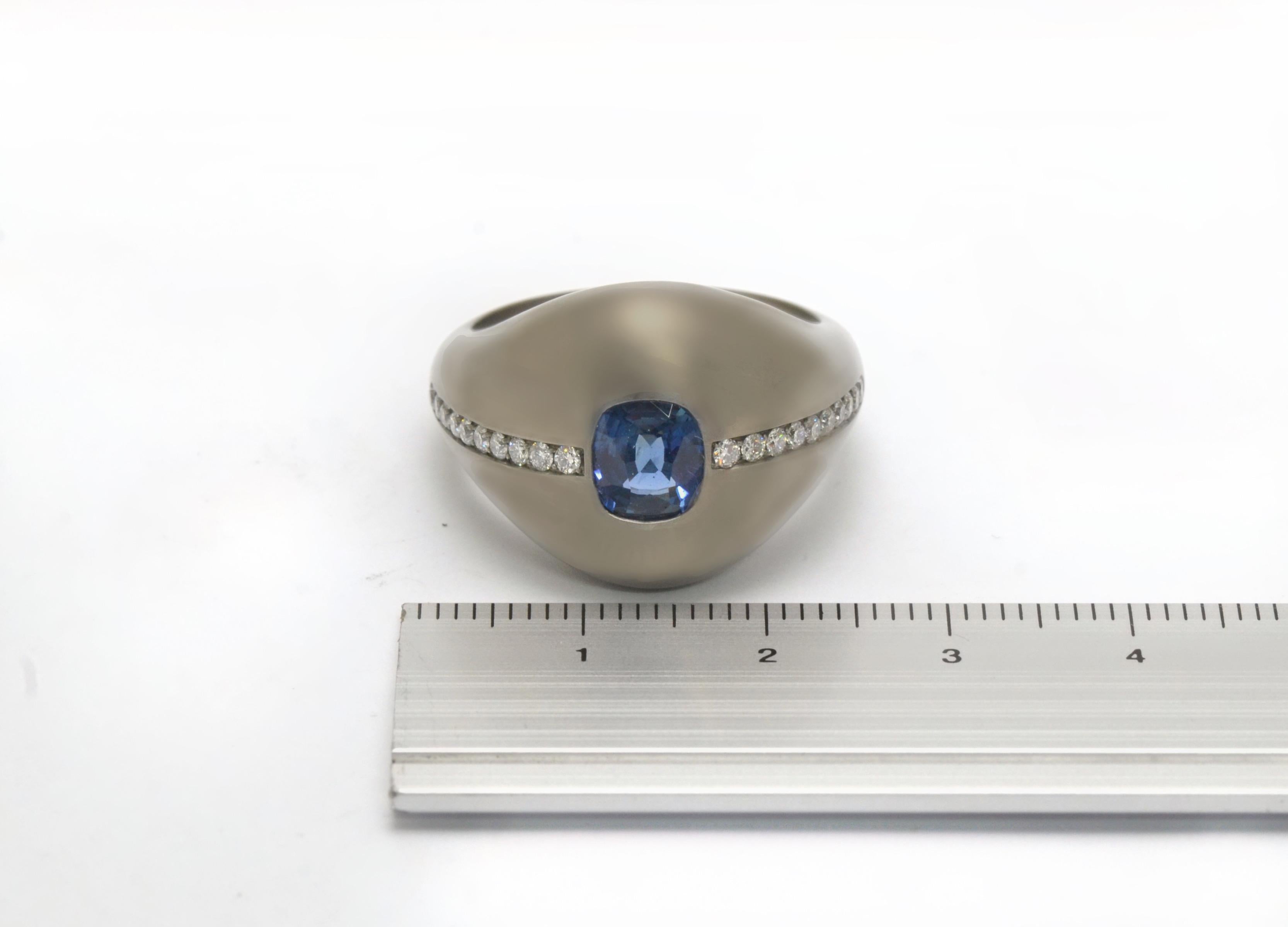 Unique, gender free ring handmade in titanium, centering an oval natural blue sapphire.
Detailed with two natural lines of white diamonds, G/F  Vvs1.  
Excellent craftsmanship, the ring had been designed and realized in Margherita Burgener family
