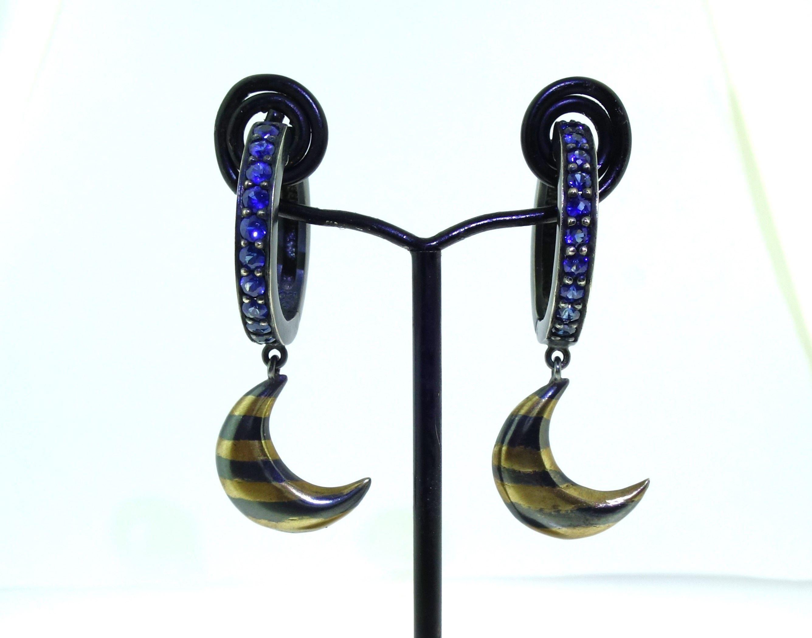 Simply Beautiful! Natural Blue and Pink Sapphire Gold and Sterling Silver Drop Earrings. Each Earring Hand set with Round Blue Sapphires, weighing approx. 1.06tcw. With one Pink Sapphire on reverse side of each Crescent Moon as trademark. The two