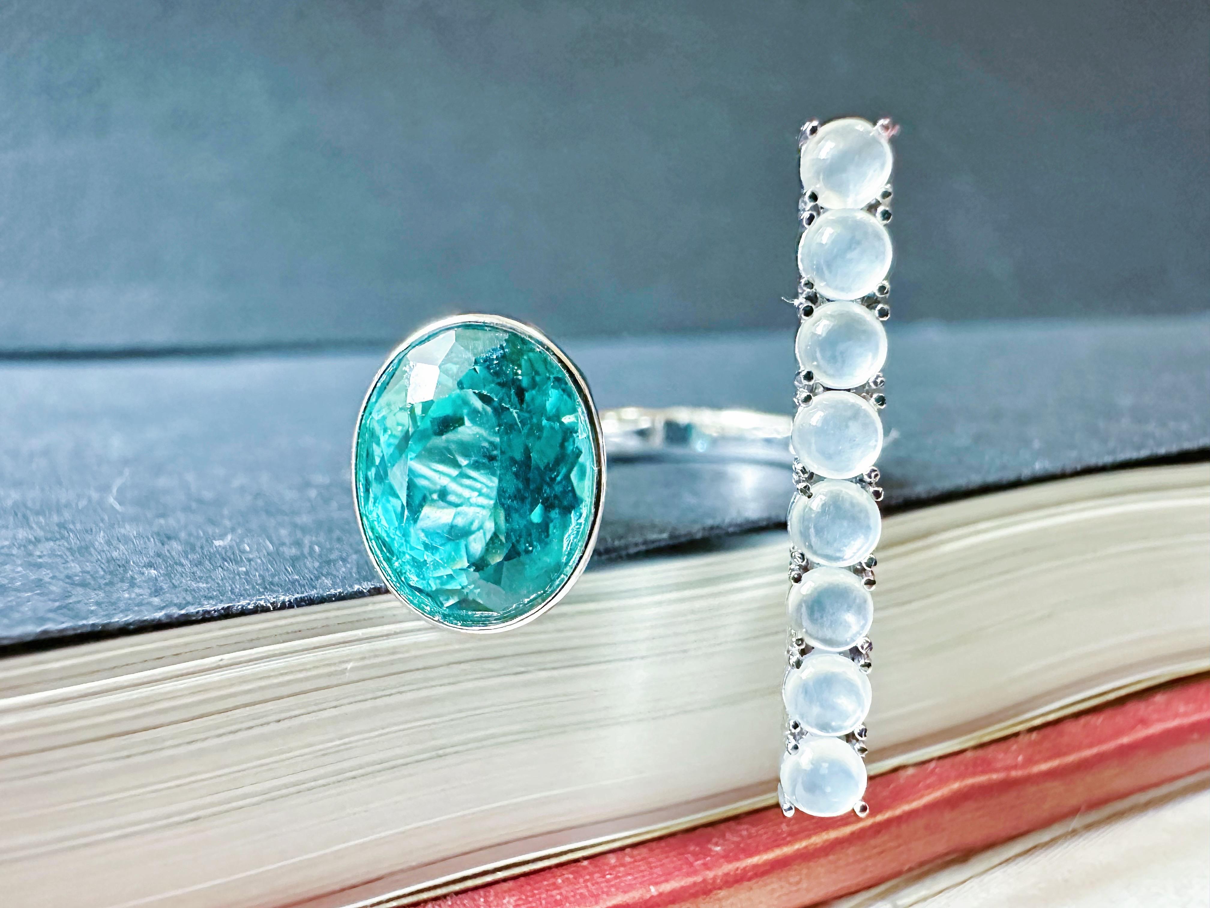 Elevate your jewelry collection with this exquisite handcrafted ring featuring grade AAA Blue Apatite and top-grade natural Myanmar icy jade cabochons. This modern and creative combination creates a unique, one-of-a-kind piece that is perfect for
