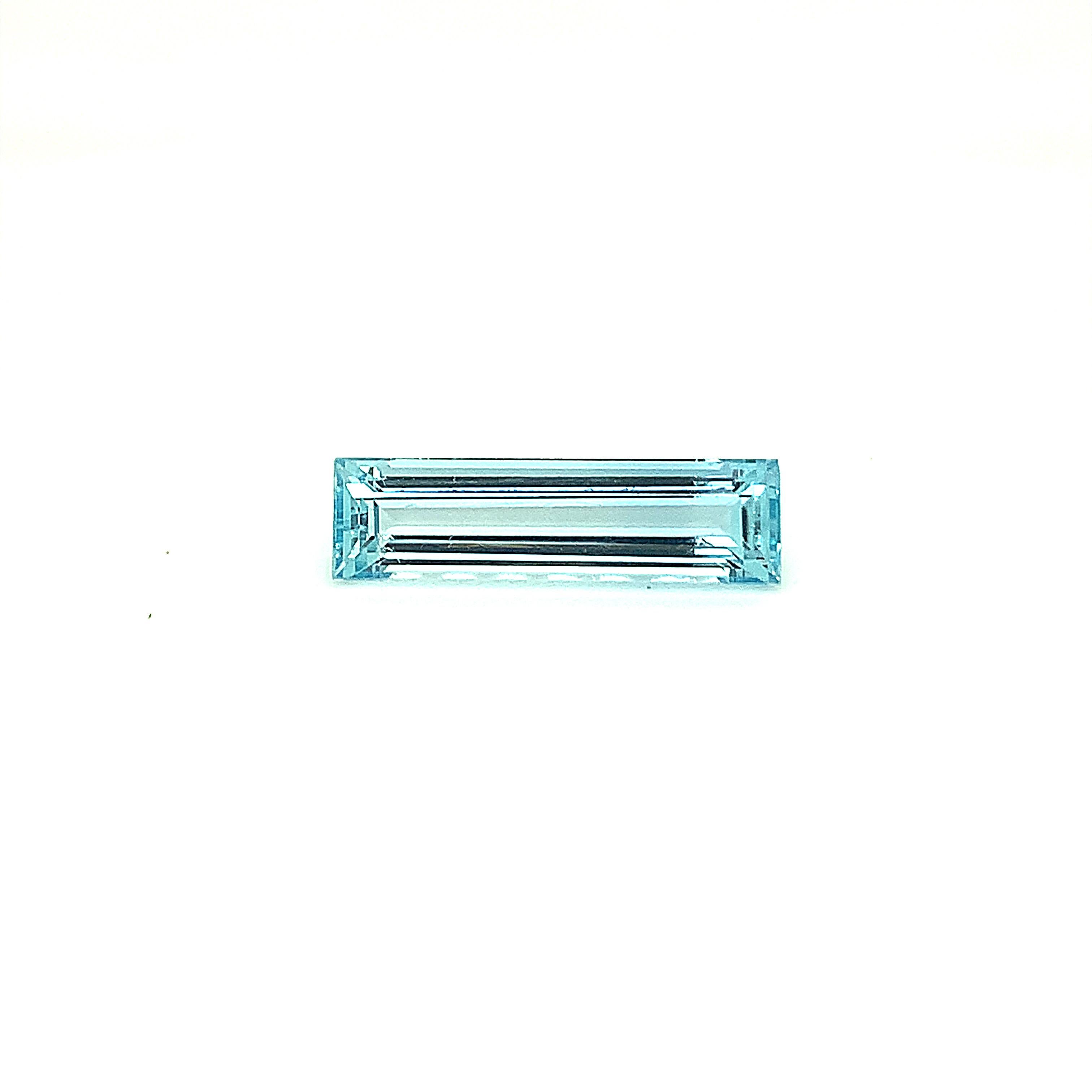 Elongated Emerald Cut Aquamarine in vivid blue color is a natural loose stone. This flawless hand cut and polished gem measures 24.42mm x 6.56mm X 4.94mm and weighs 8.55 carat. It can be crafted into a fine piece of jewelry according to your