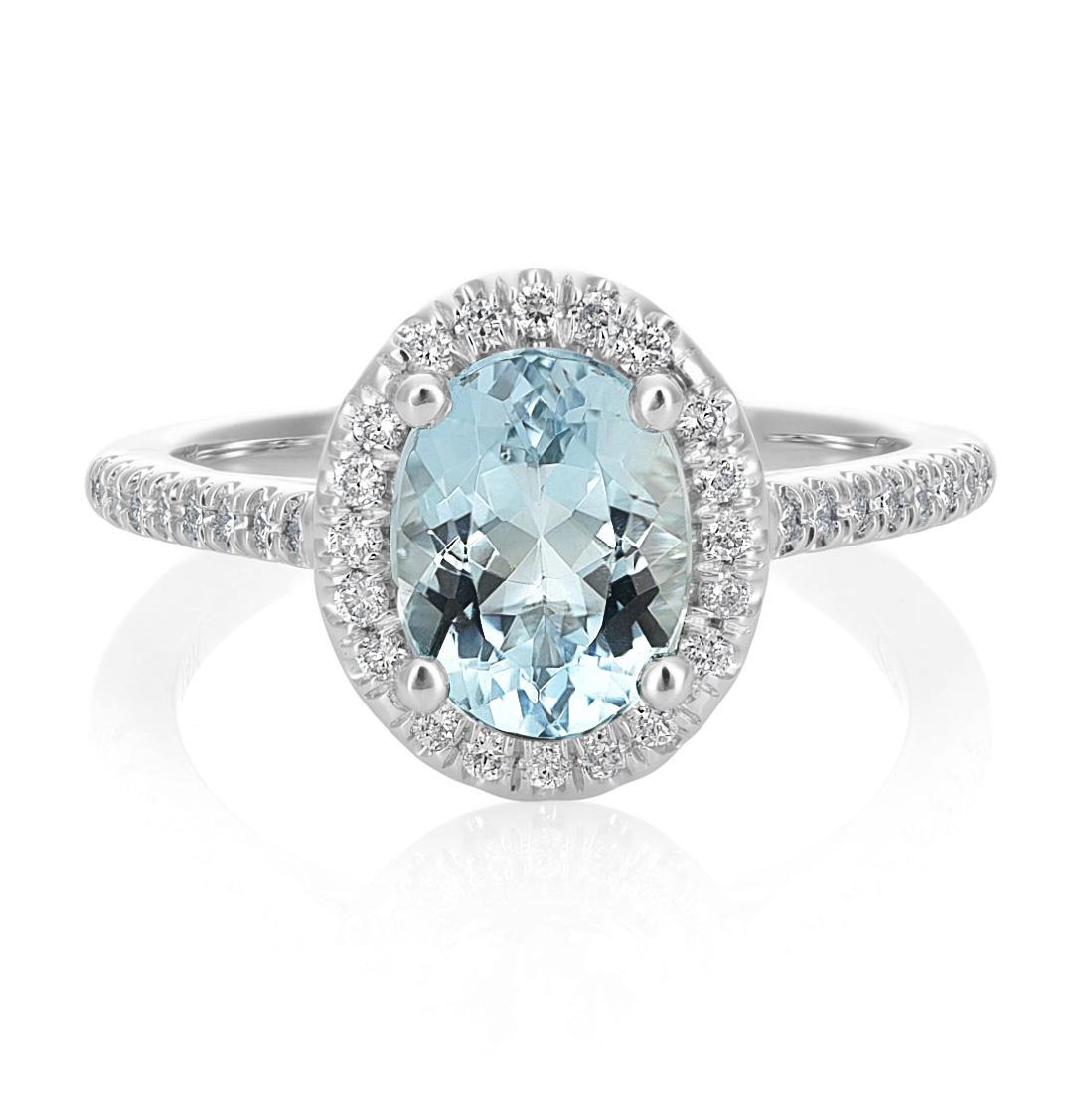 Discover the captivating elegance of this natural aquamarine ring, exquisitely set in 14K white gold. This exceptional piece, complemented by sparkling diamonds, showcases the finest craftsmanship and the enchanting beauty of these precious