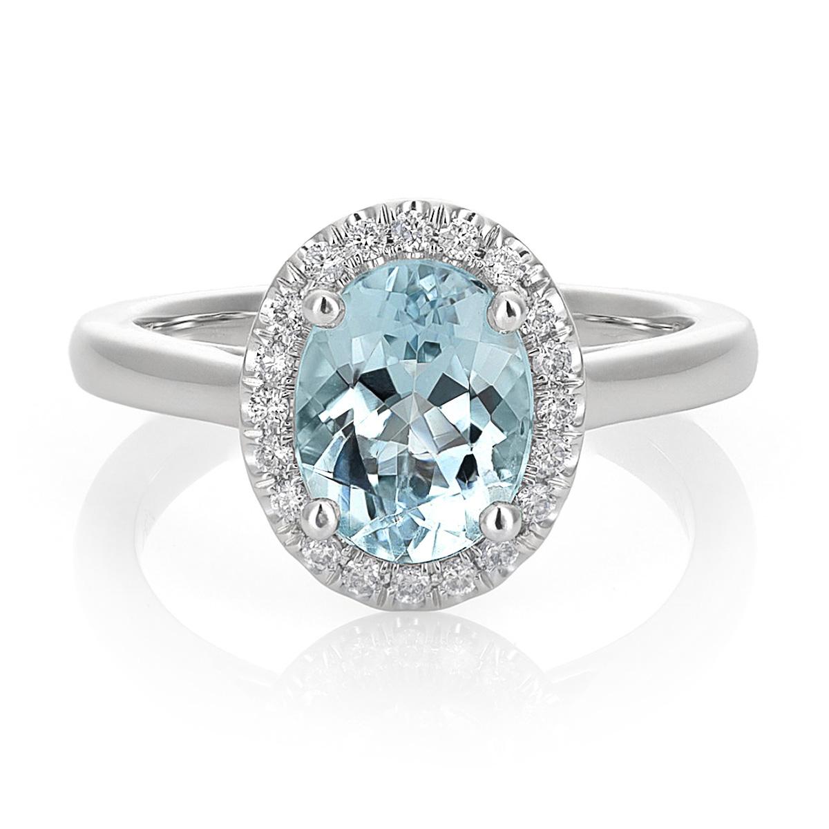 Discover the captivating elegance of this natural aquamarine ring, exquisitely set in 14K white gold. This exceptional piece, complemented by sparkling diamonds, showcases the finest craftsmanship and the enchanting beauty of these precious