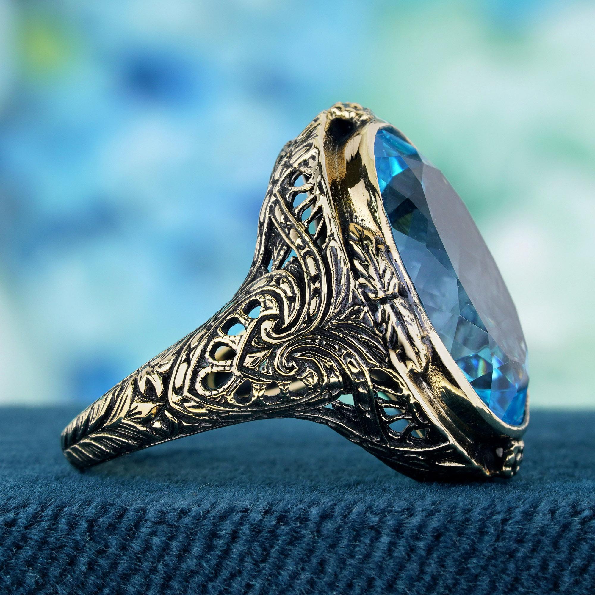 Oval Cut Natural Blue Blue Topaz Vintage Style Cocktail Ring in Solid 9K Yellow Gold For Sale