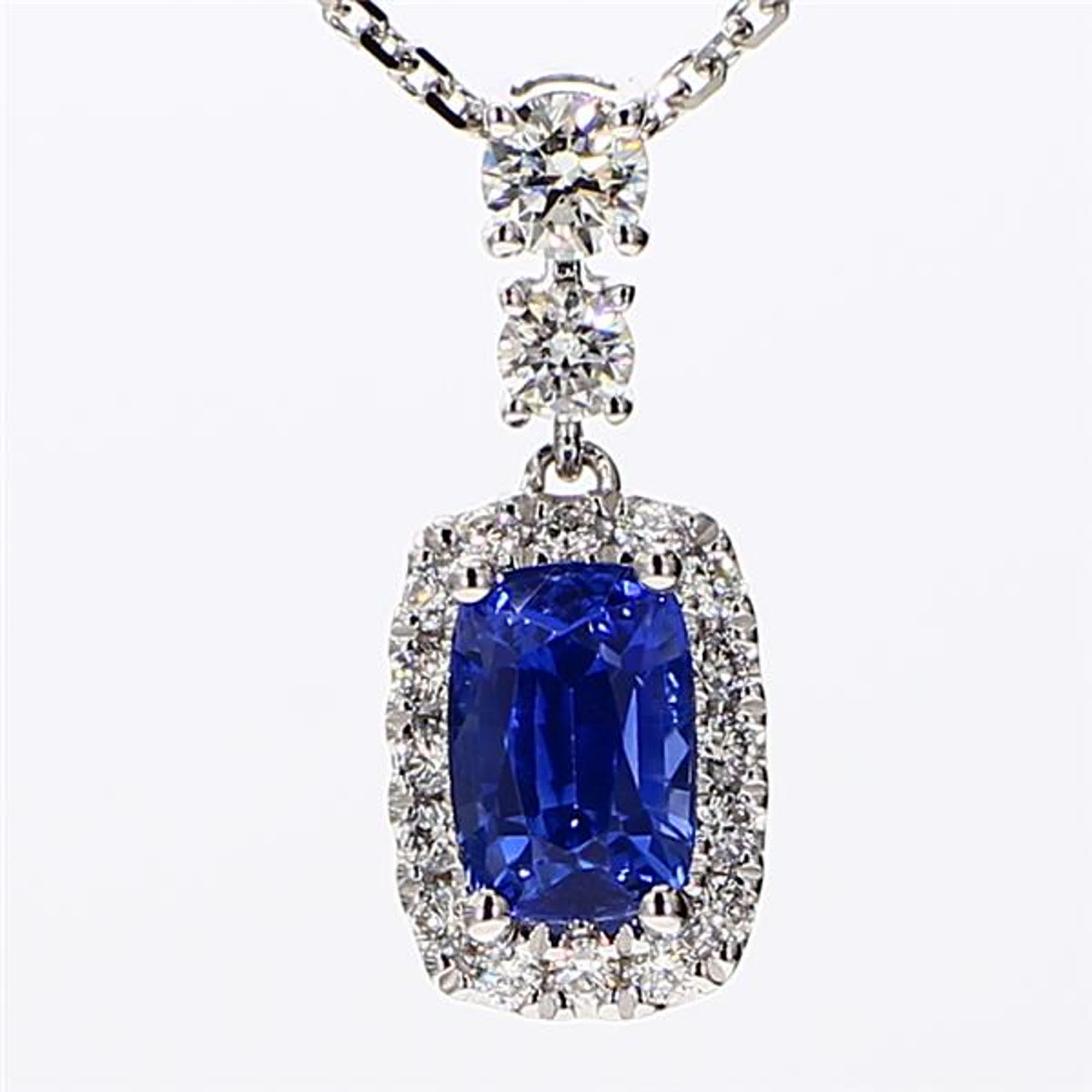 RareGemWorld's classic sapphire pendant. Mounted in a beautiful 18K White Gold setting with a natural cushion cut blue sapphire. The sapphire is surrounded by natural round white diamond melee. This pendant is guaranteed to impress and enhance your