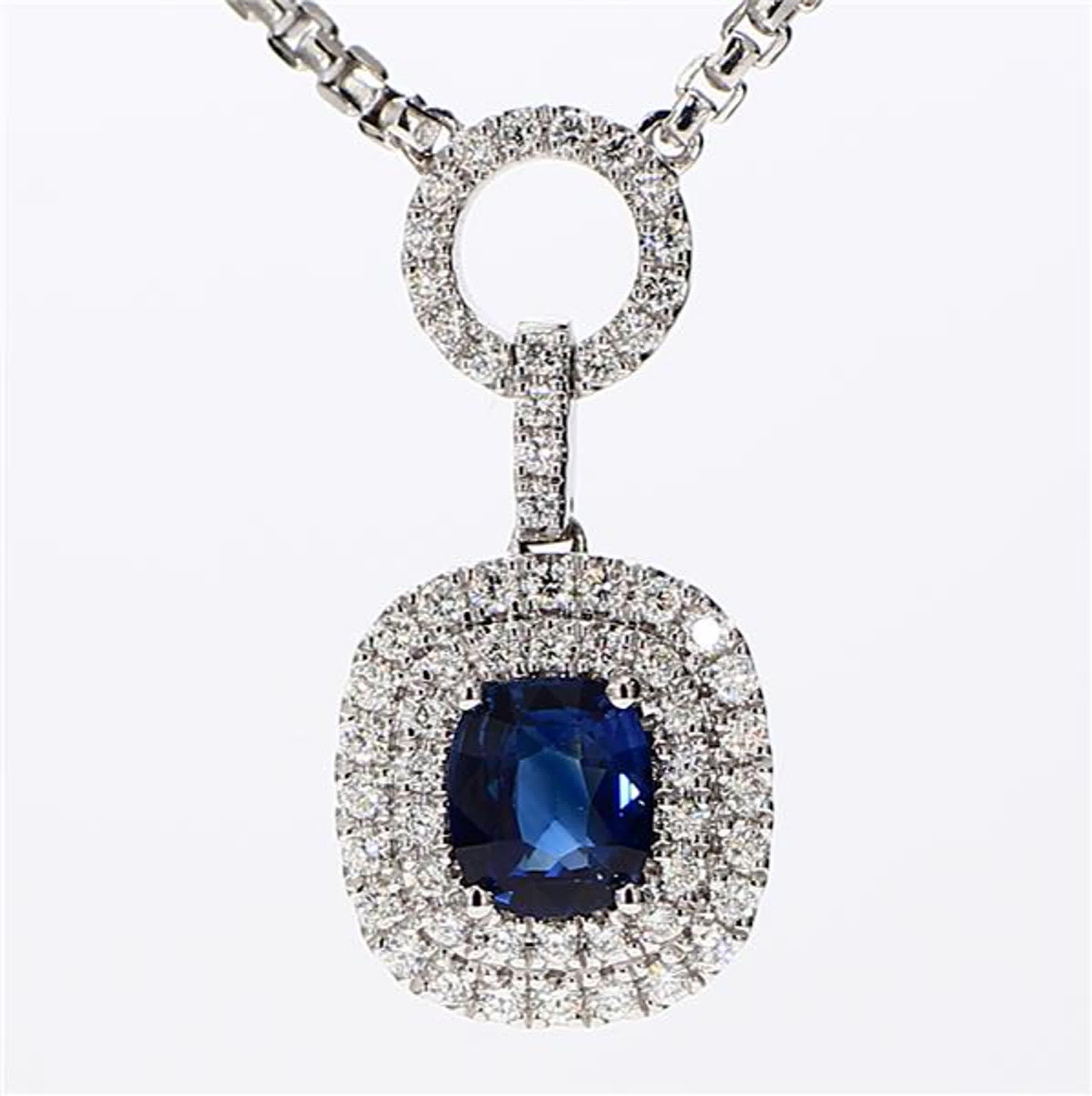 RareGemWorld's classic sapphire pendant. Mounted in a beautiful 18K White Gold setting with a natural cushion cut blue sapphire. The sapphire is surrounded by natural round white diamond melee. This pendant is guaranteed to impress and enhance your