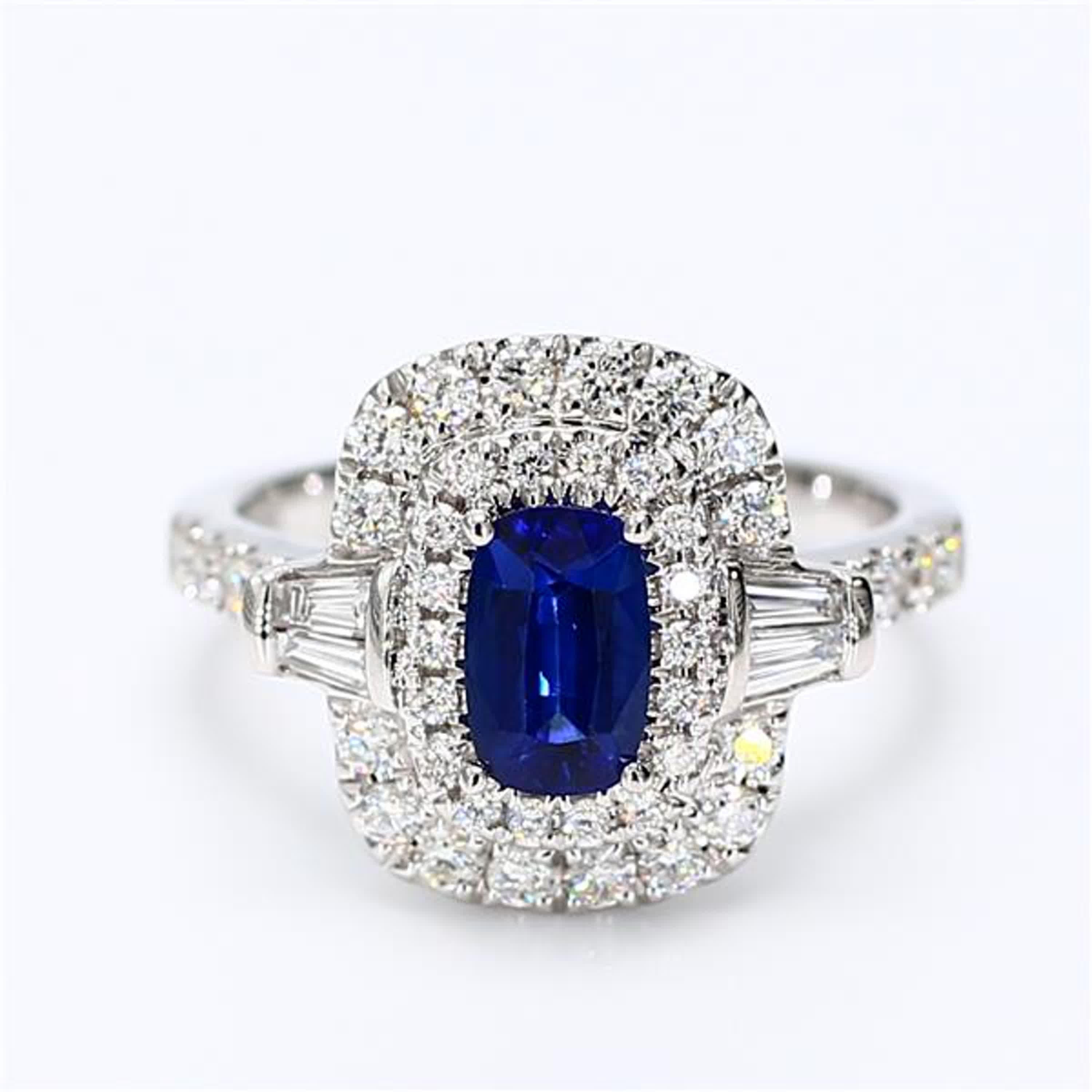 RareGemWorld's classic sapphire ring. Mounted in a beautiful 18K White Gold setting with a natural cushion cut blue sapphire. The sapphire is surrounded by natural baguette cut white diamonds and natural round white diamond melee. This ring is