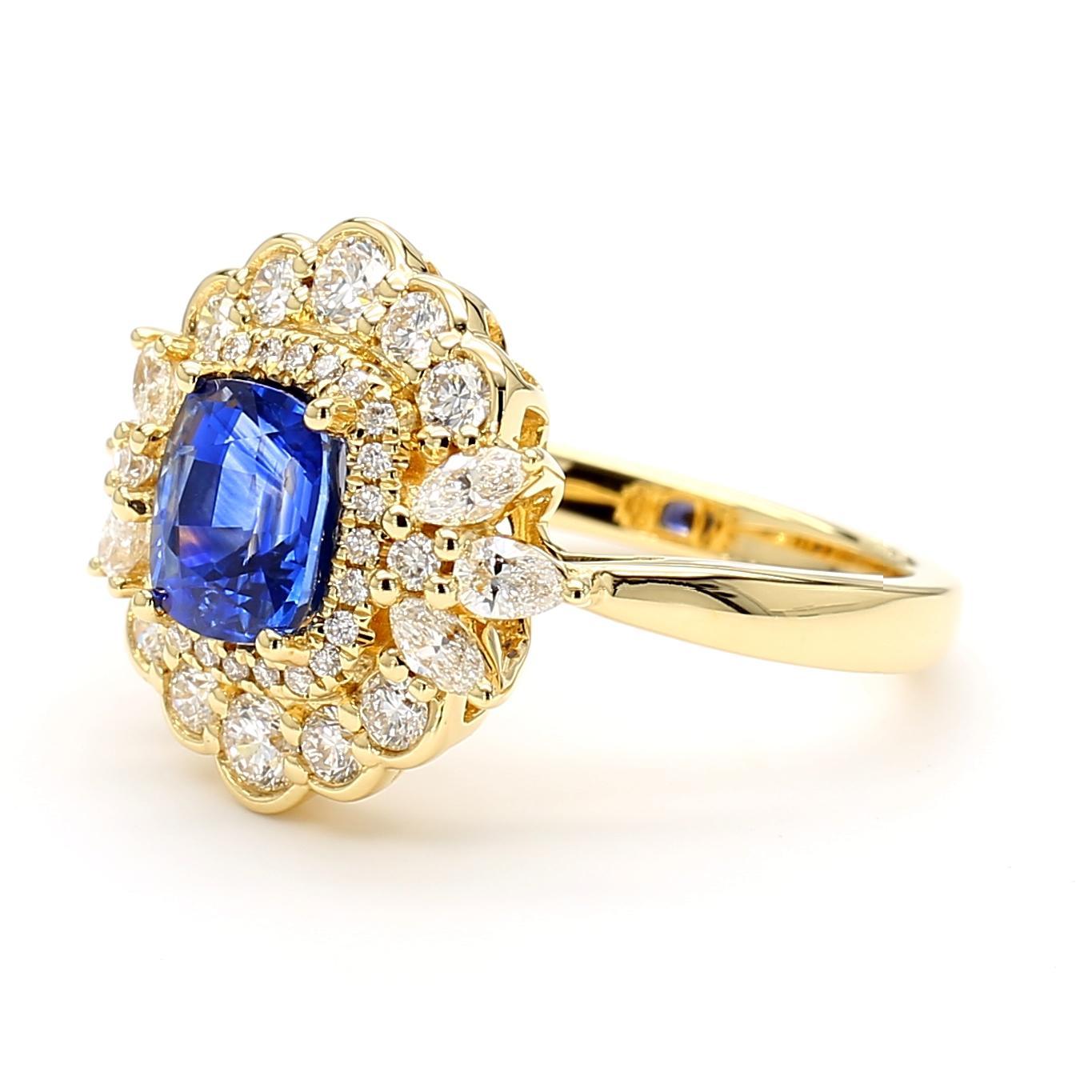 RareGemWorld's beautiful sapphire ring. Mounted in a beautiful 18K Yellow Gold setting with a natural cushion cut blue sapphire. The sapphire is surrounded by natural round white diamond melee, natural marquise cut white diamonds, and natural pear