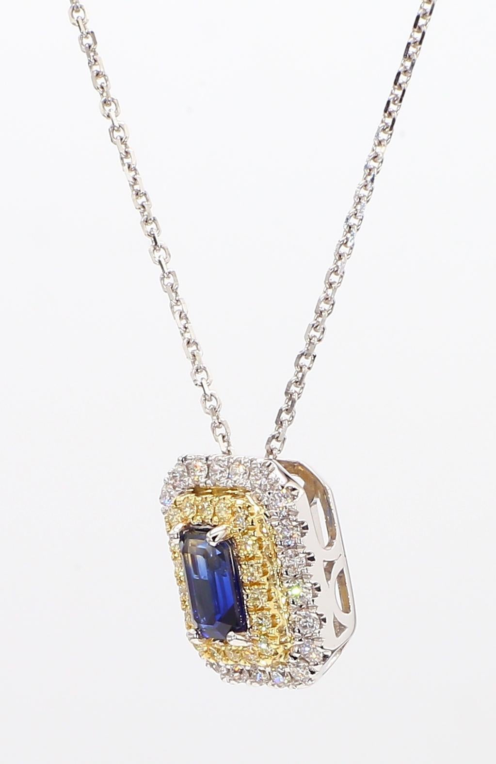 RareGemWorld's classic sapphire pendant. Mounted in a beautiful 18K Yellow and White Gold setting with a natural emerald cut blue sapphire. The sapphire is surrounded by natural round white diamond melee and natural round yellow diamond melee. This