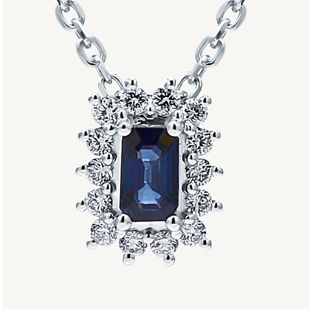 Natural Blue Emerald Cut Sapphire and White Diamond .49 Carat TW Gold Pendant For Sale