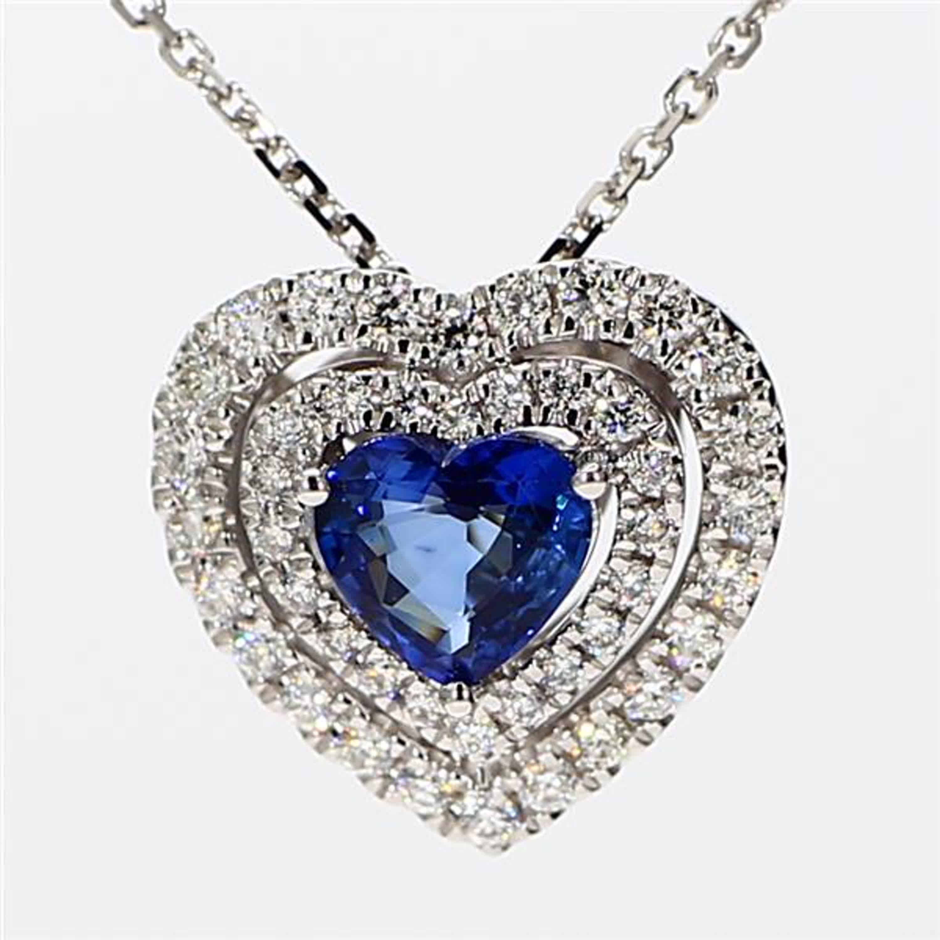 RareGemWorld's classic sapphire pendant. Mounted in a beautiful 18K White Gold setting with a natural heart cut blue sapphire. The sapphire is surrounded by natural round white diamond melee. This pendant is guaranteed to impress and enhance your