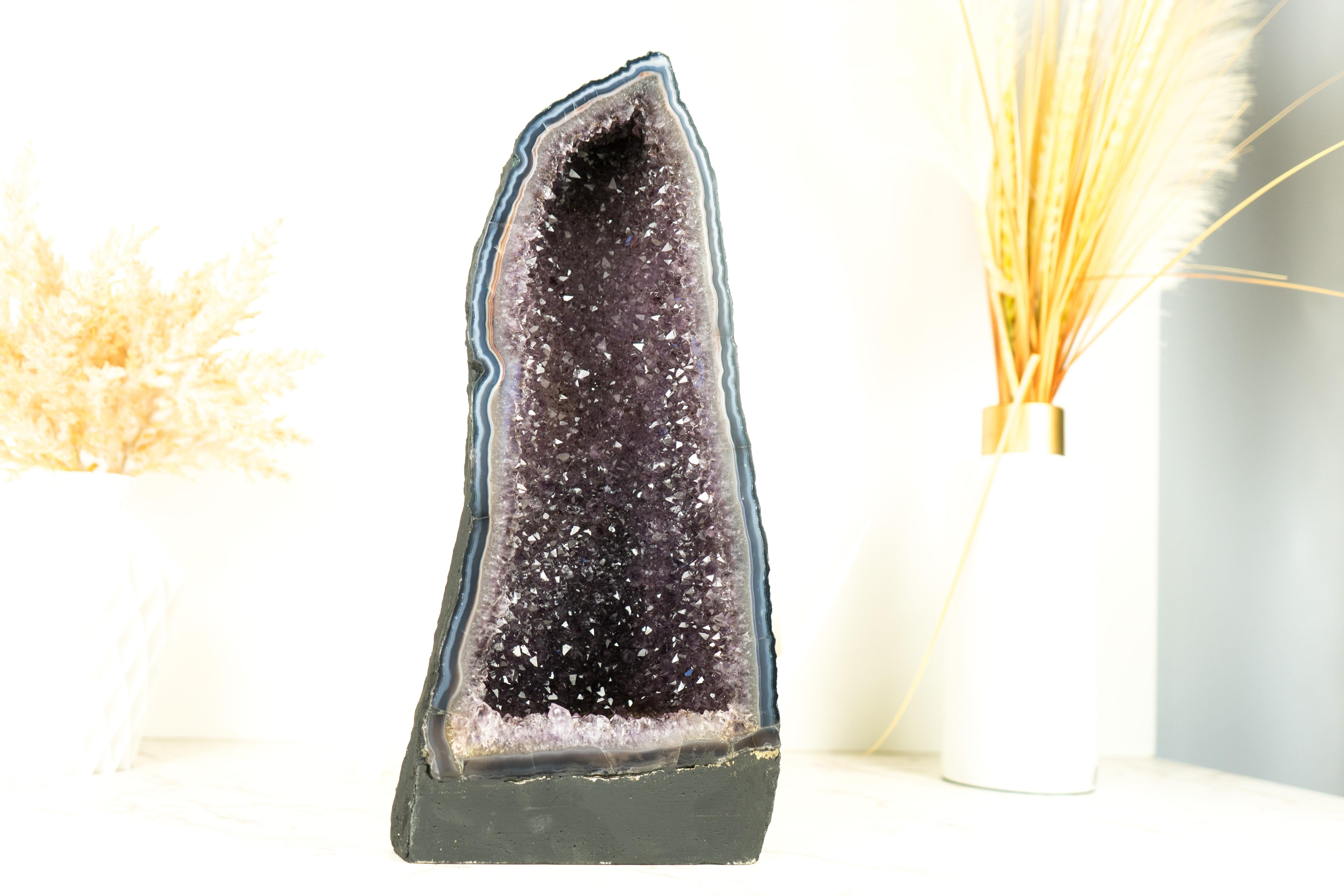 An Agate Geode that will elevate your space with its sparkly Lavender Amethyst Druzy and rare lace agate formation, this geode brings beauty and sophistication to any home or office decor, be it a table, shelf, or a special space.

The first thing
