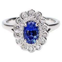 Natural Blue Oval Sapphire and White Diamond 1.62 Carat TW Gold Cocktail Ring