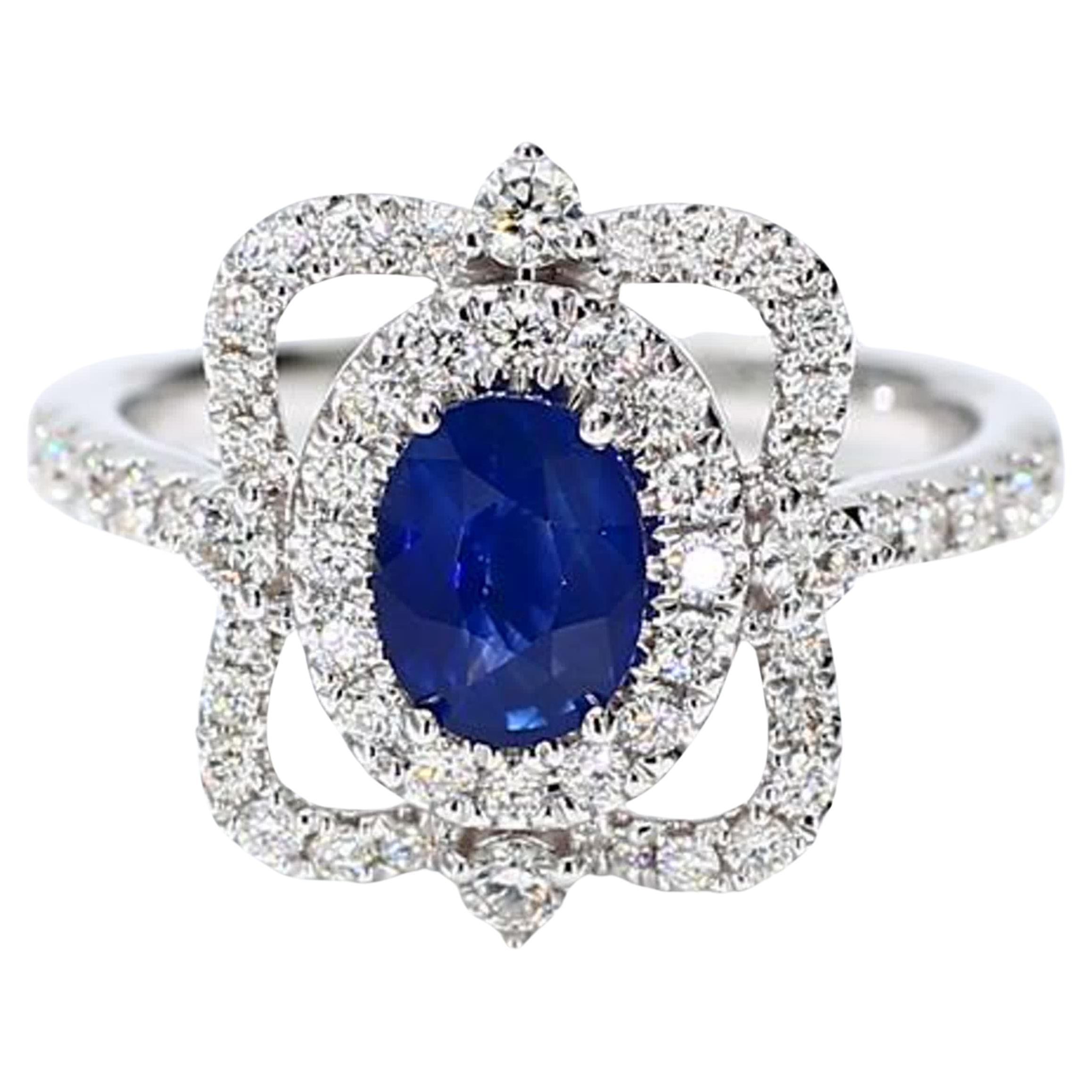 Natural Blue Oval Sapphire and White Diamond 1.62 Carat TW Gold Cocktail Ring For Sale