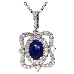 Natural Blue Oval Sapphire and White Diamond 1.64 Carat TW White Gold Pendant
