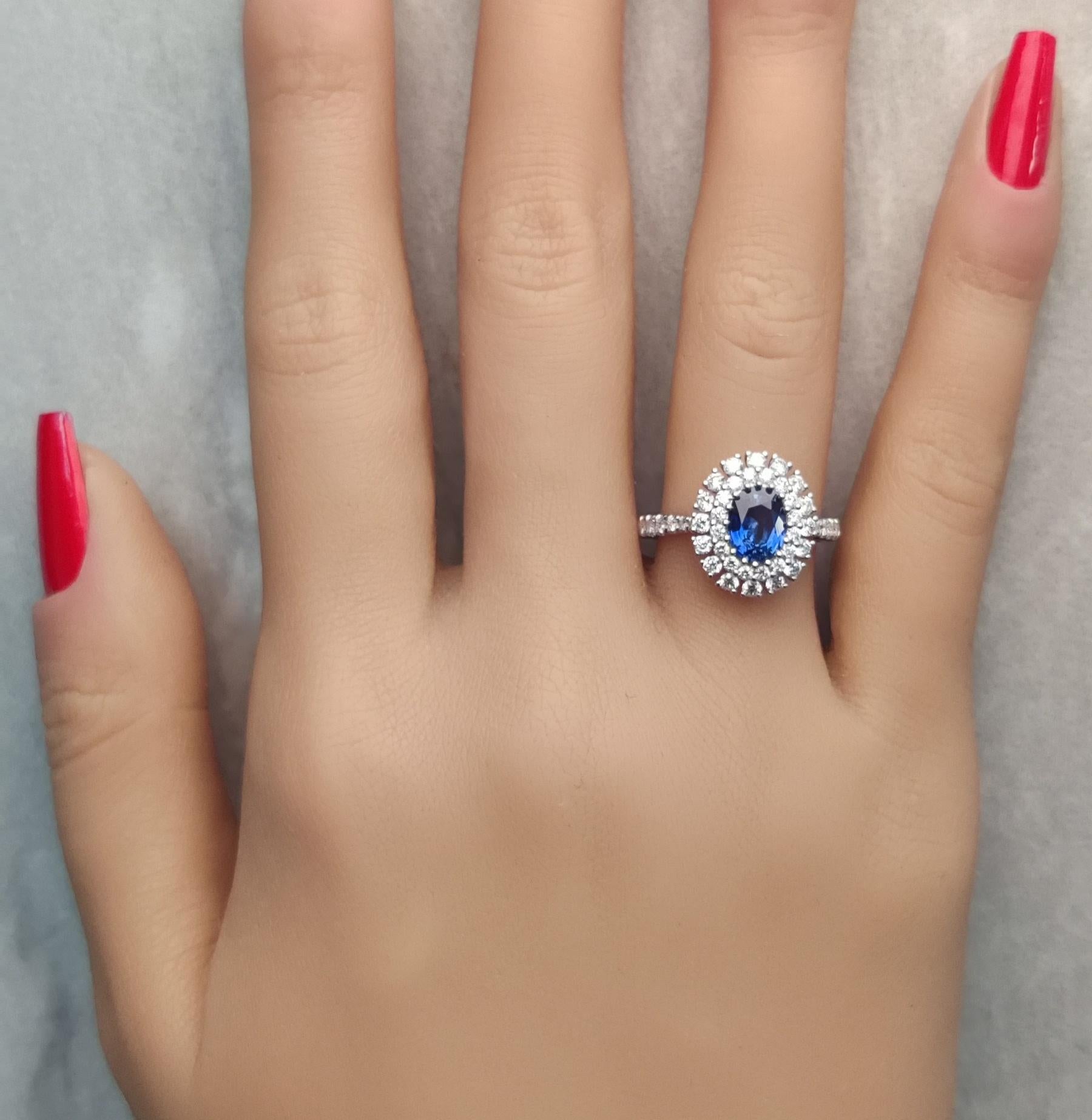 Contemporary Natural Blue Oval Sapphire and White Diamond 1.85 Carat TW Gold Cocktail Ring For Sale