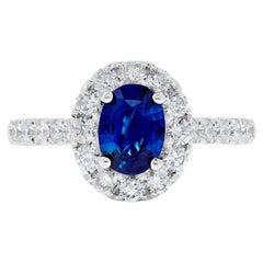 Natural Blue Oval Sapphire and White Diamond 1.88 Carat TW Gold Cocktail Ring