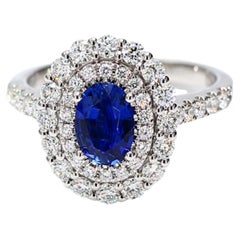 Natural Blue Oval Sapphire and White Diamond 1.97 Carat TW Gold Cocktail Ring