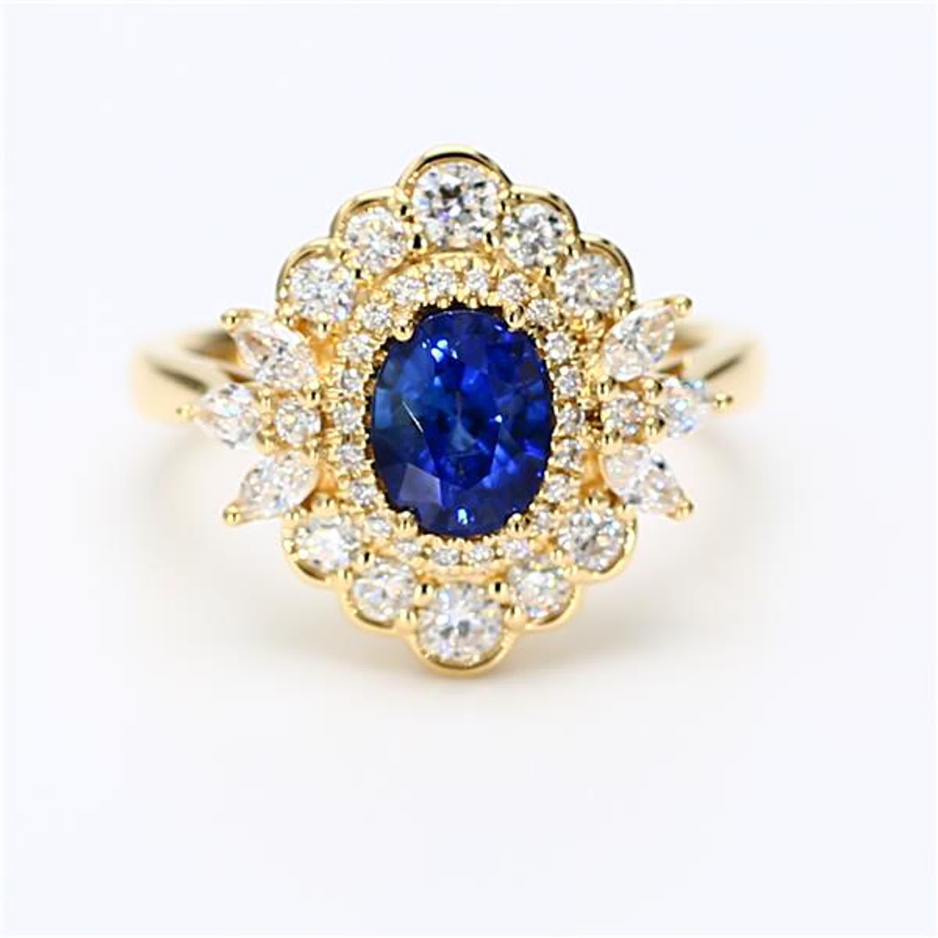 RareGemWorld's classic sapphire ring. Mounted in a beautiful 18K Yellow Gold setting with a natural oval cut blue sapphire. The sapphire is surrounded by natural marquise cut white diamonds, natural pear cut white diamonds, and natural round white