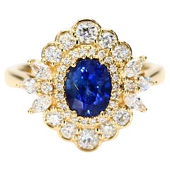 Natural Blue Oval Sapphire and White Diamond 2.11 Carat TW Gold Cocktail Ring