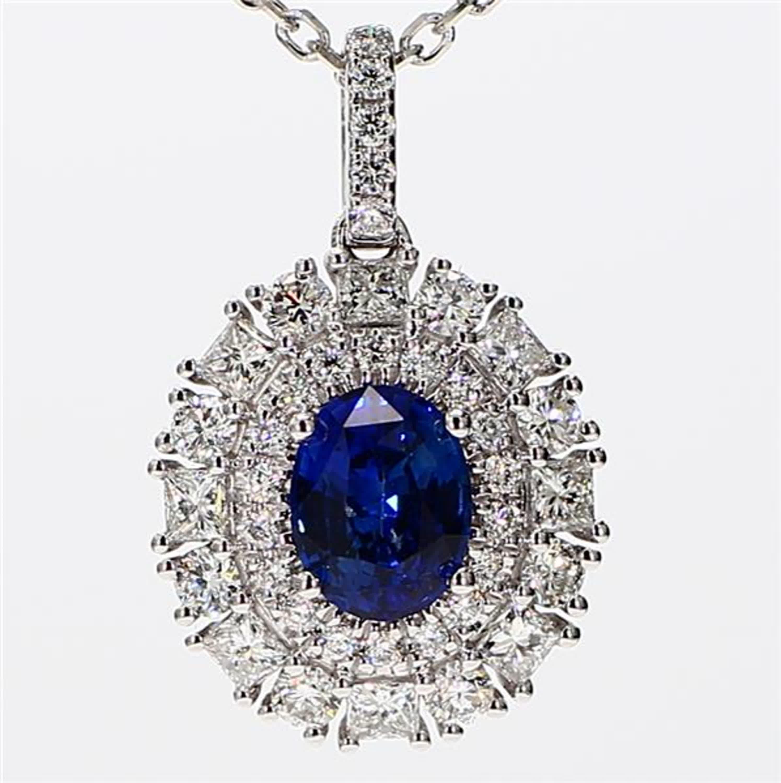 RareGemWorld's classic sapphire pendant. Mounted in a beautiful 18K White Gold setting with a natural oval cut blue sapphire. The sapphire is surrounded by natural princess cut white diamonds and natural round white diamond melee. This pendant is