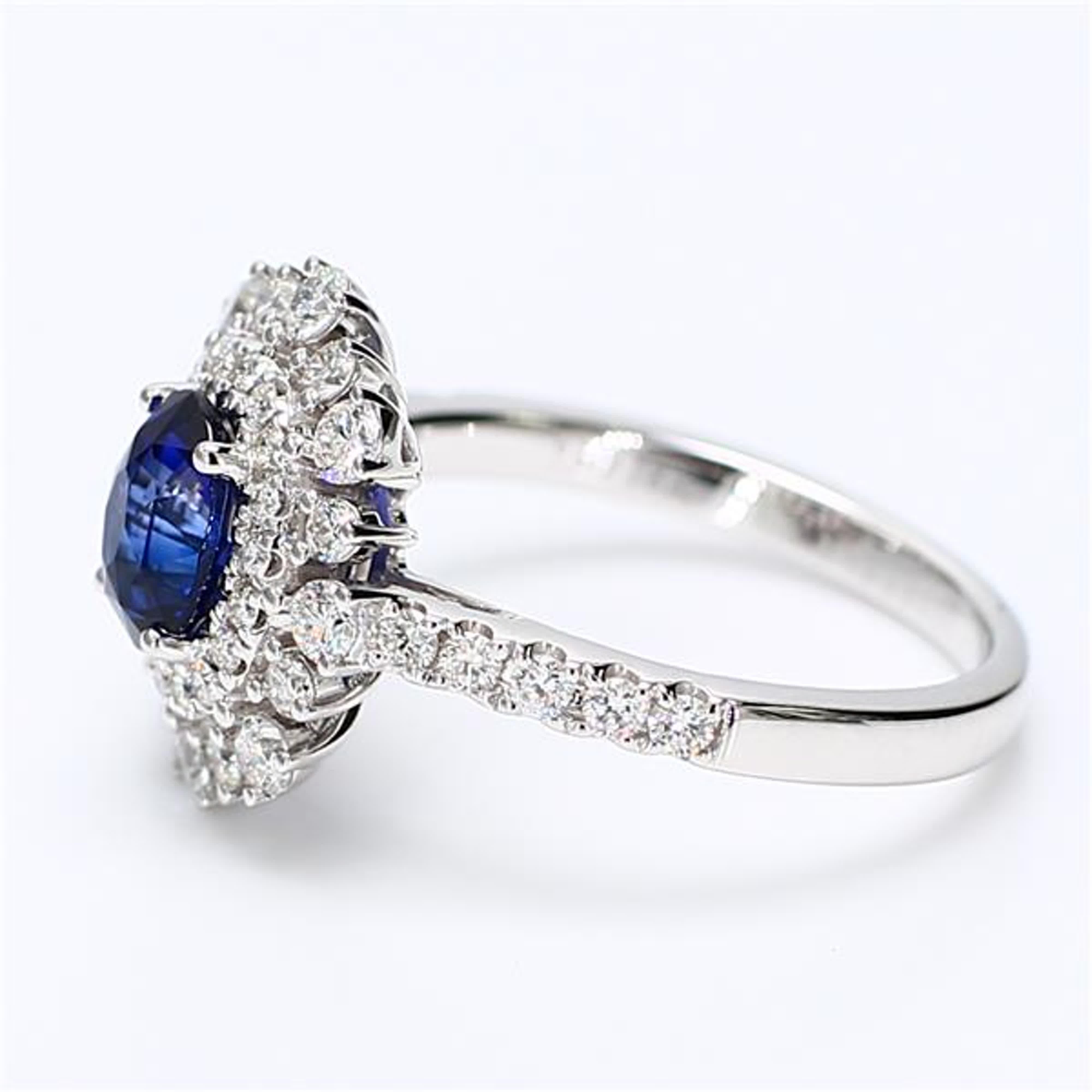 Contemporary Natural Blue Oval Sapphire and White Diamond 2.11 Carat TW White Gold Ring For Sale