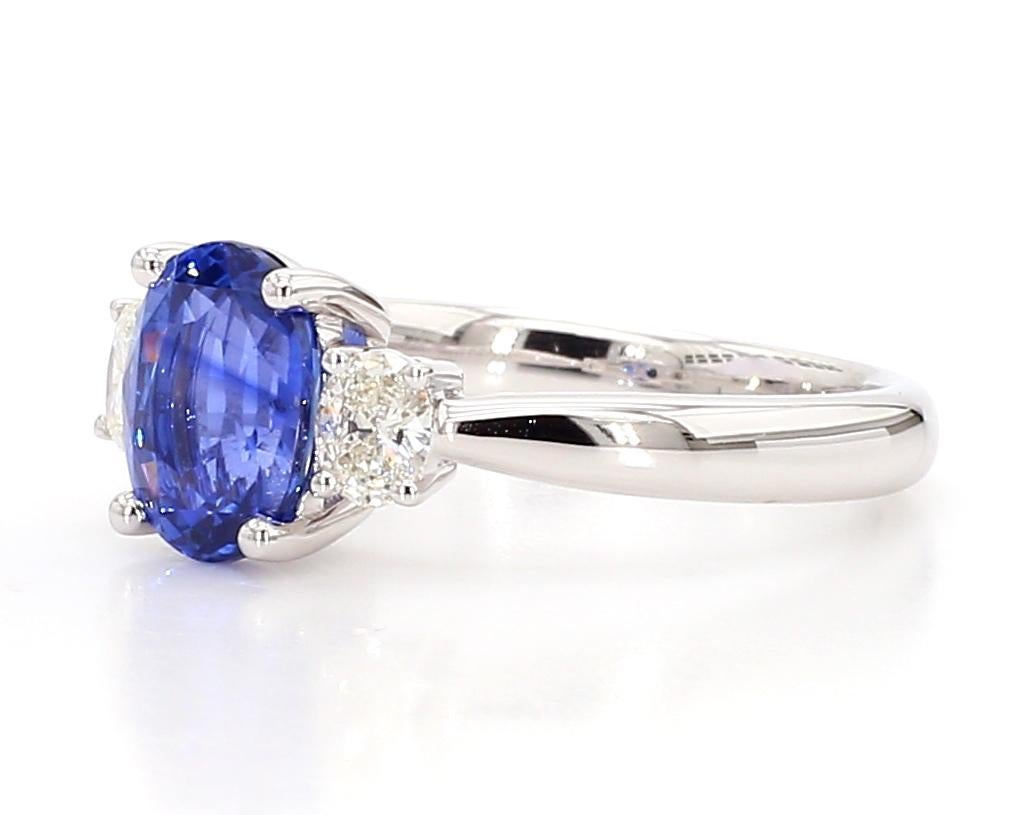 Contemporary Natural Blue Oval Sapphire and White Diamond 2.37 Carat TW Gold Cocktail Ring For Sale