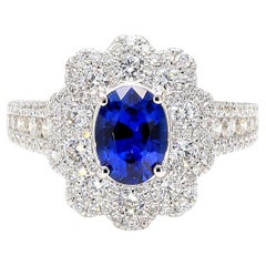 Natural Blue Oval Sapphire and White Diamond 2.44 Carat TW Gold Cocktail Ring