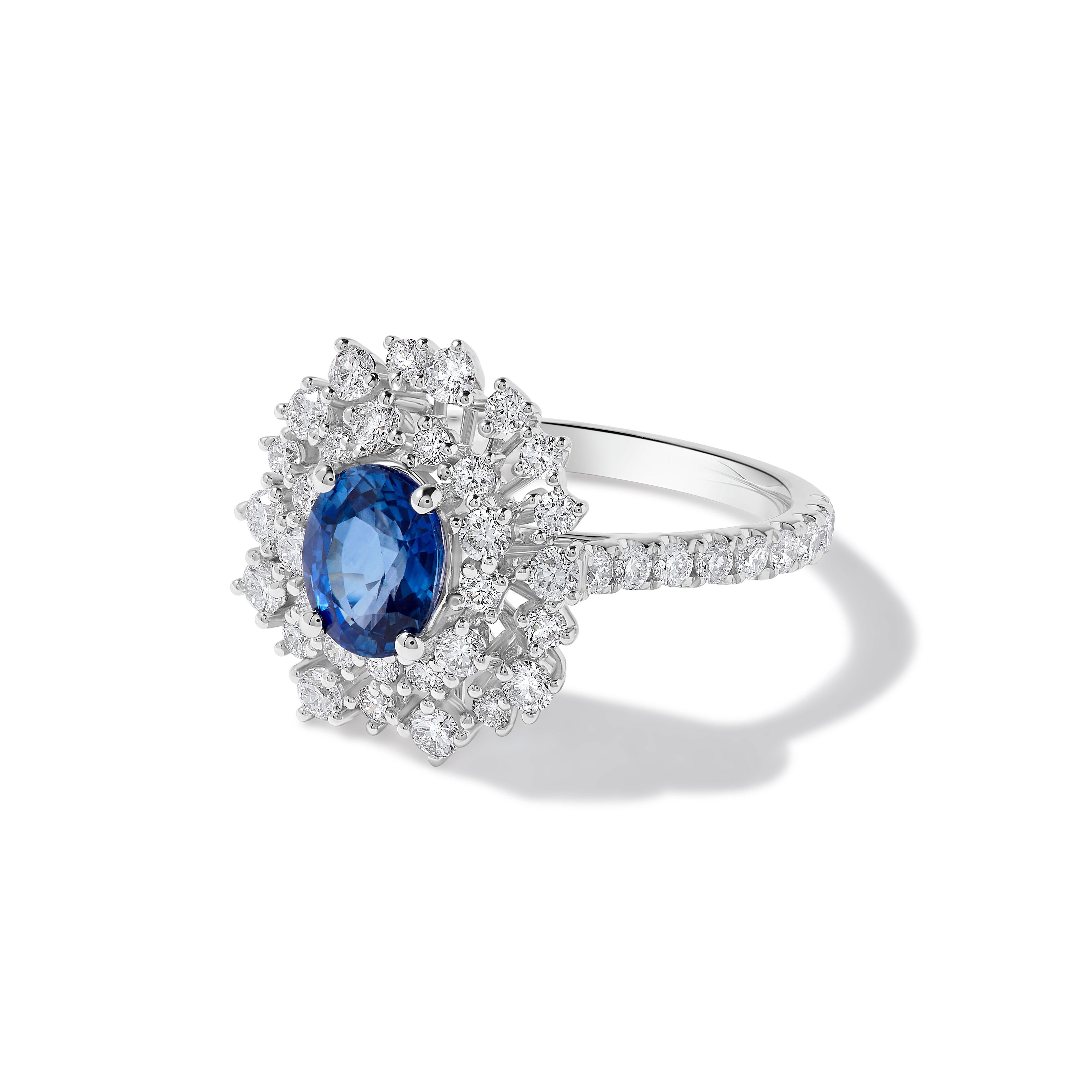 Contemporary Natural Blue Oval Sapphire and White Diamond 2.86 Carat TW Gold Cocktail Ring For Sale