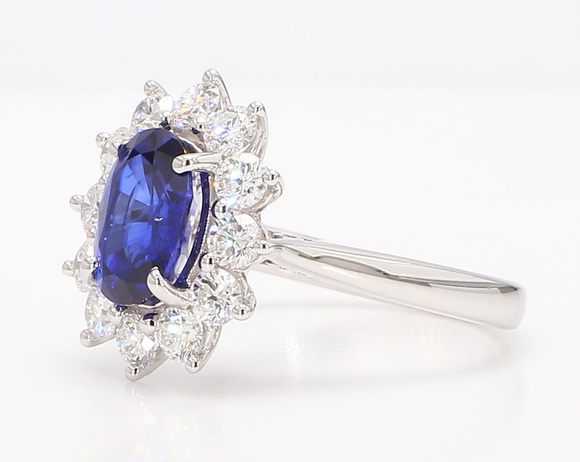Contemporary Natural Blue Oval Sapphire and White Diamond 2.88 Carat TW Gold Cocktail Ring For Sale