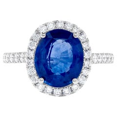 Natural Blue Oval Sapphire and White Diamond 4.78 Carat TW Gold Cocktail Ring