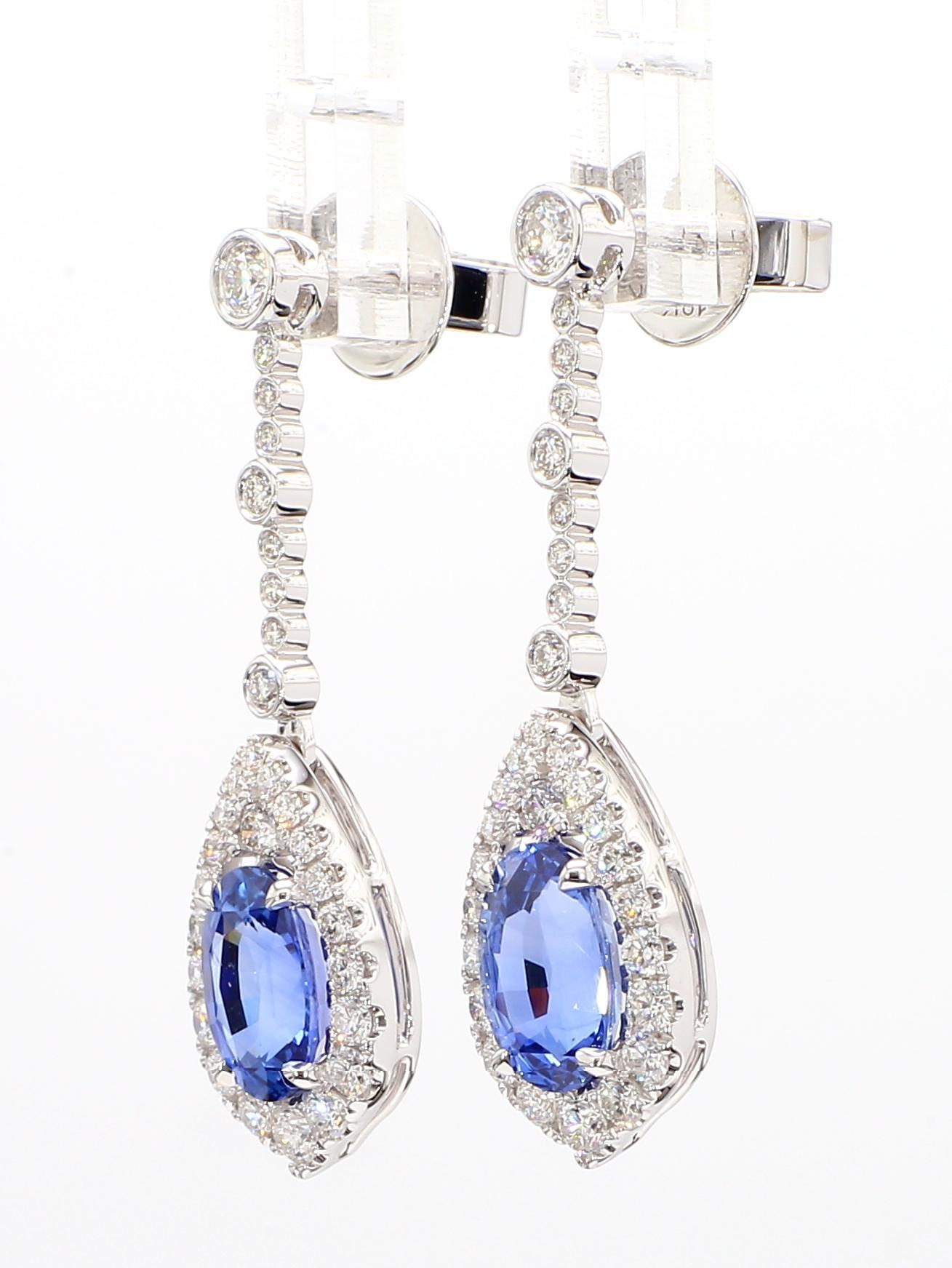 Contemporary Natural Blue Oval Sapphire and White Diamond 5.20 Carat TW Gold Drop Earrings For Sale