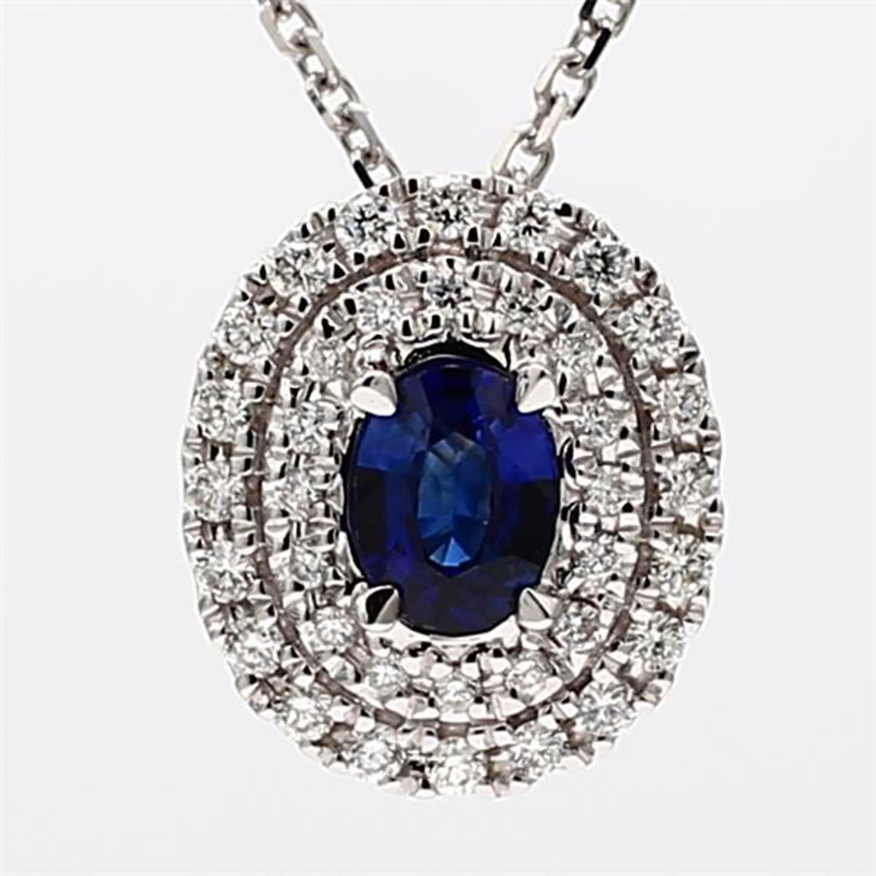 RareGemWorld's classic sapphire pendant. Mounted in a beautiful 18K White Gold setting with a natural oval cut blue sapphire. The sapphire is surrounded by natural round white diamond melee. This pendant is guaranteed to impress and enhance your