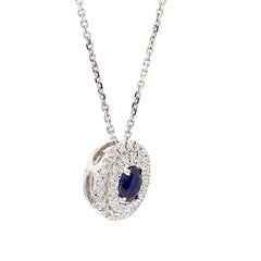Natural Blue Oval Sapphire and White Diamond .67 Carat TW White Gold Pendant