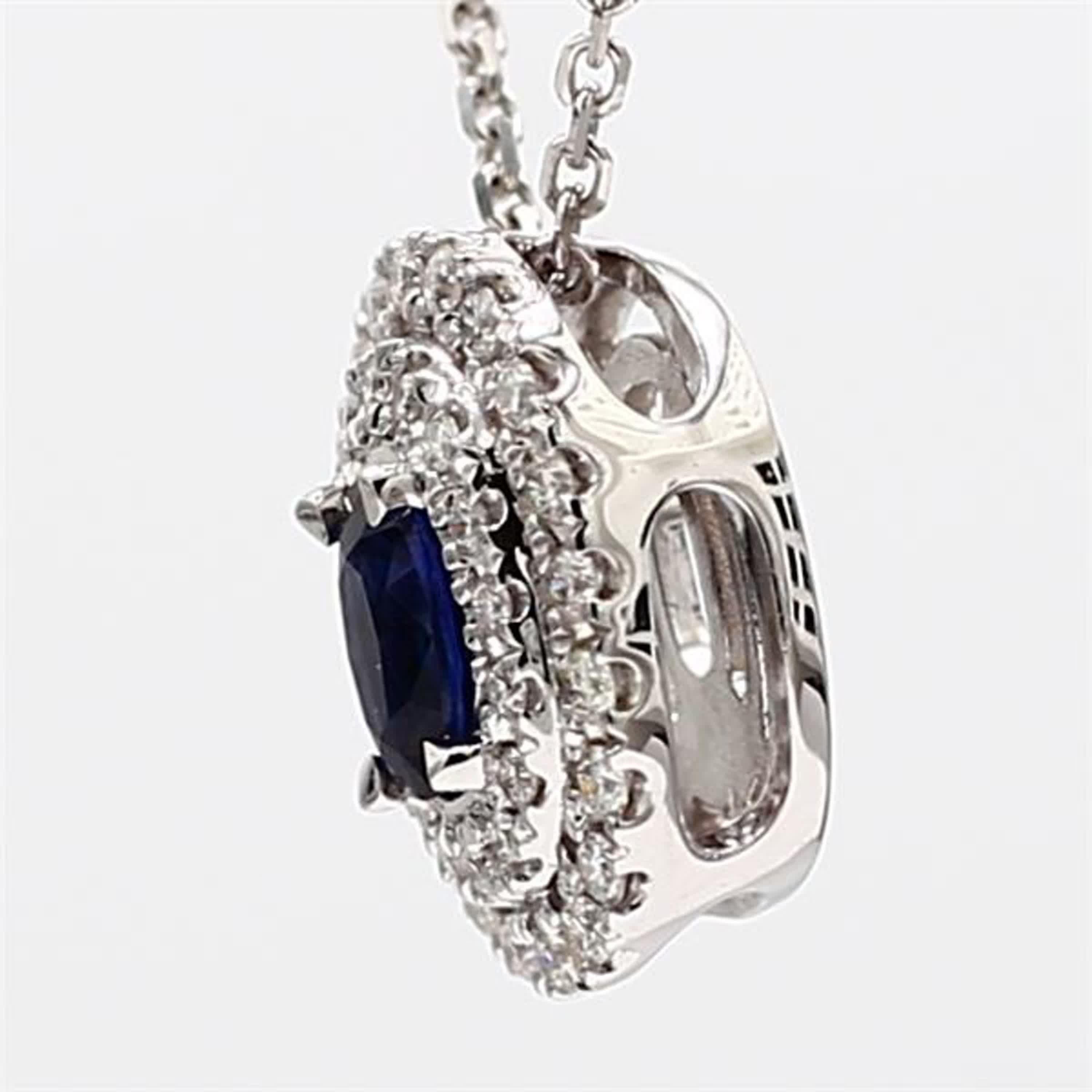 Contemporary Natural Blue Oval Sapphire and White Diamond .67 Carat TW White Gold Pendant For Sale