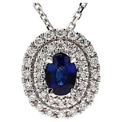 Natural Blue Oval Sapphire and White Diamond .67 Carat TW White Gold Pendant