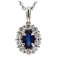 Natural Blue Oval Sapphire and White Diamond .99 Carat TW White Gold Pendant